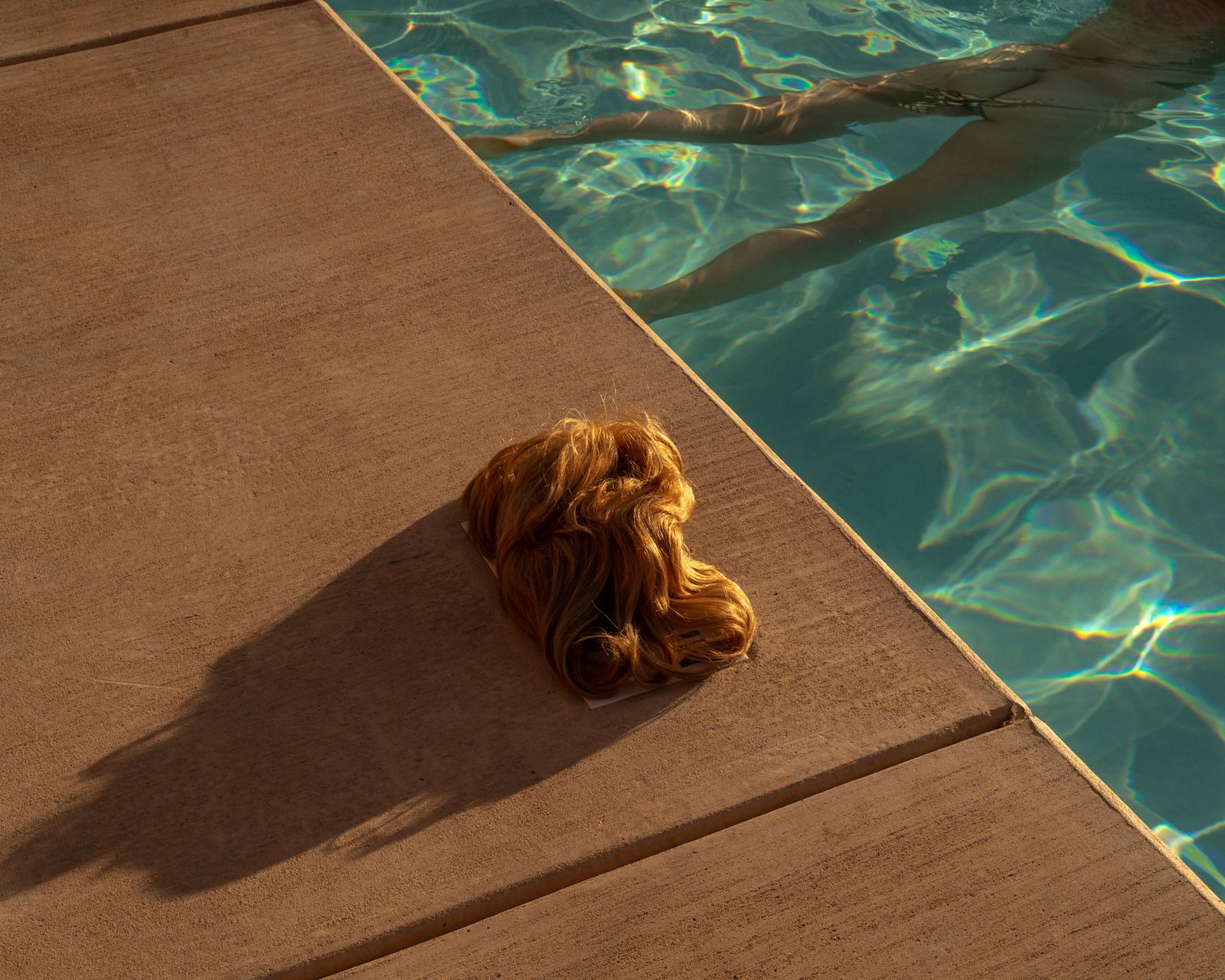 © Tania Franco Klein - Pool, Wig (self-portrait)