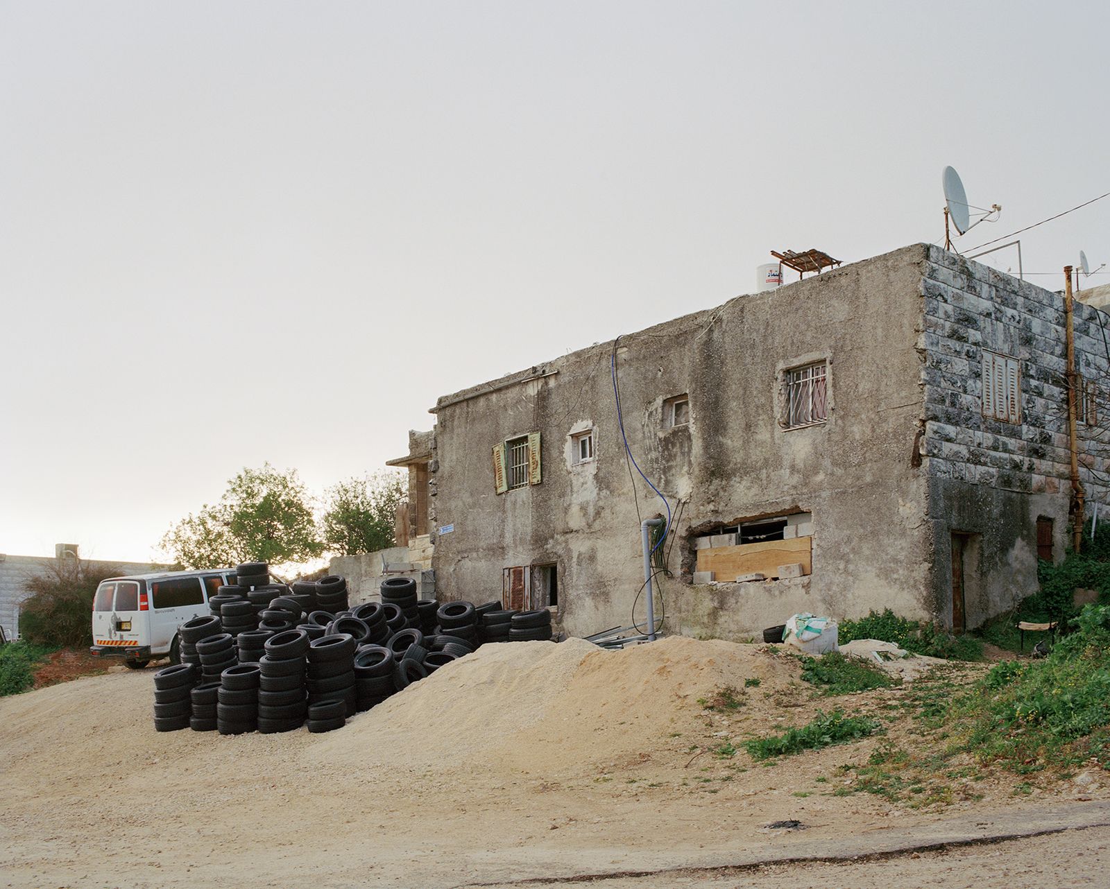 © Saja Quttaineh - Many tires in the backyard of a house in Shuafat neighborhood, Jerusalem city, 2021