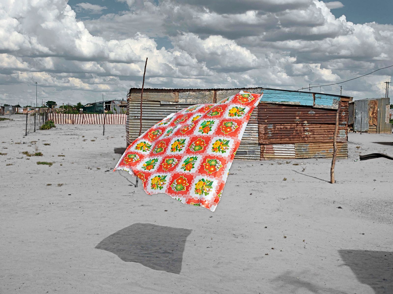 © Graeme Williams - Phutanang township, Kimberley, South Africa. 2011. A torn tablecloth dries in the wind.