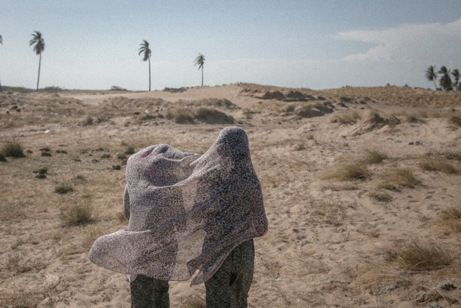 © Fabiola Ferrero - Two girls play with a scarf at Guajira desert, in the Venezuelan border with Colombia. Taken on February 2017.