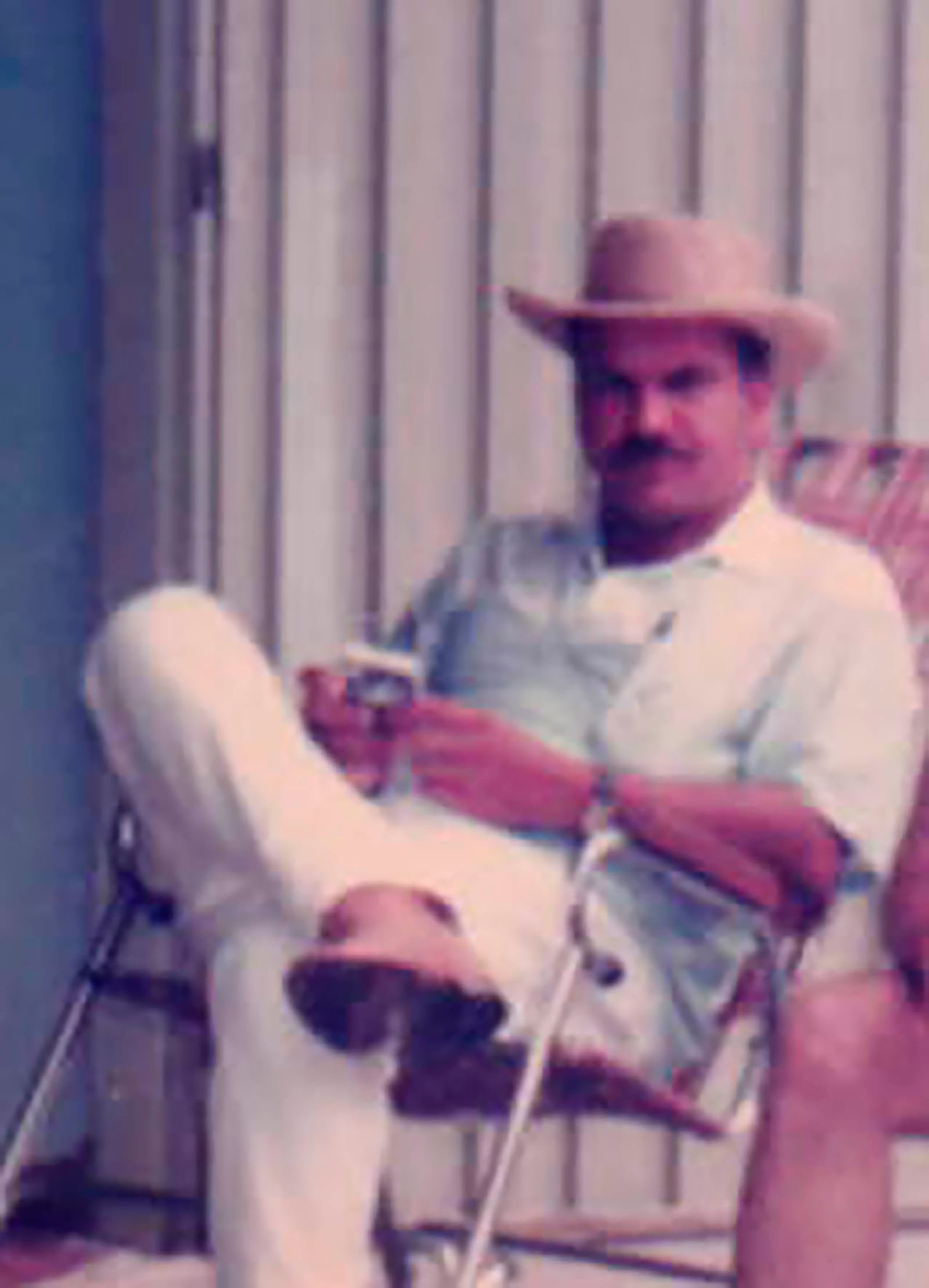 © Alejandra Arévalo - Naún sitting in my aunts' backyard. This is one of the few photographs where his face is recognizable.