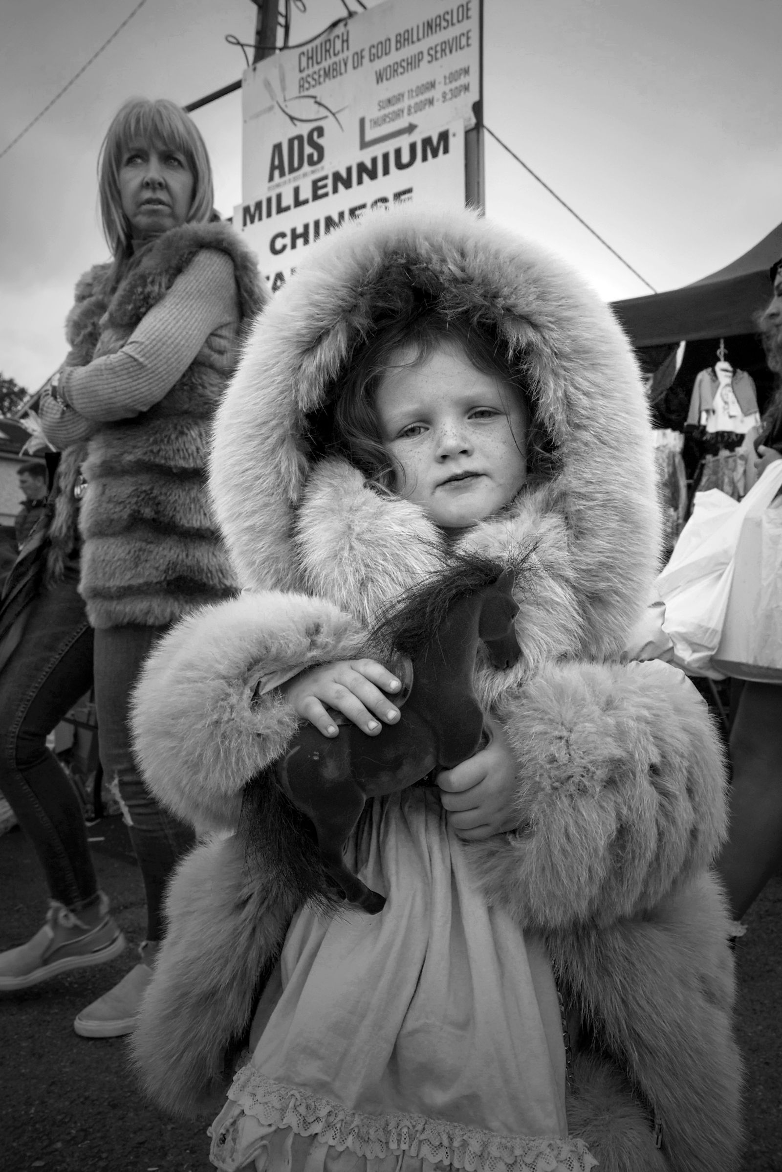 © Rebecca Moseman - Dolly Horse. Ballinasloe, Ireland. A young girl dresses up in traditional clothing for the Ballinasloe Horse Fair.