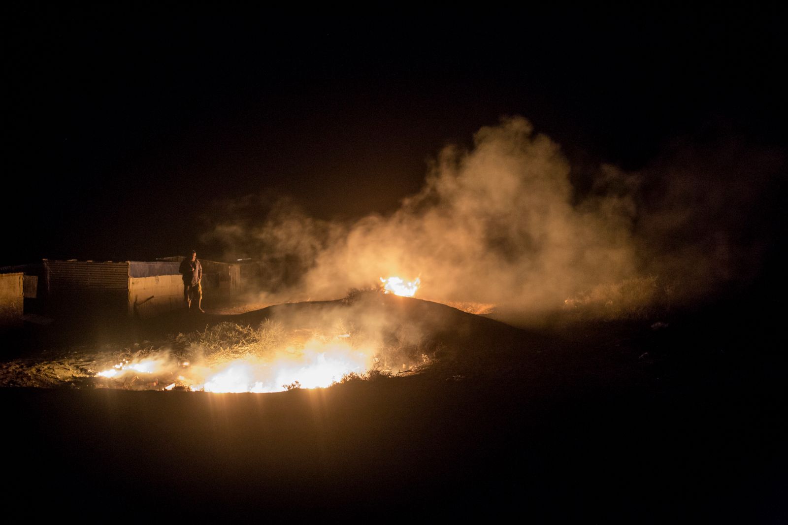 © Federico Vespignani - Punta Arena, Baja California, Mexico.Fishermen burn trash and carcasses at night.