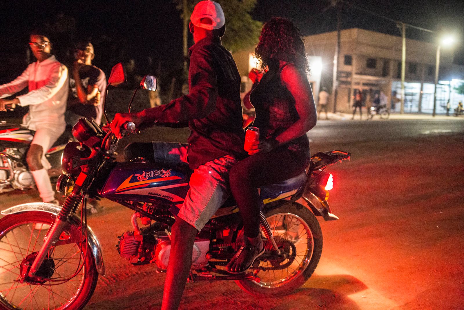 © TaraTW - A sex worker gets on a clients motorbike in Tete, Tete province, Mozambique May 11, 2018.
