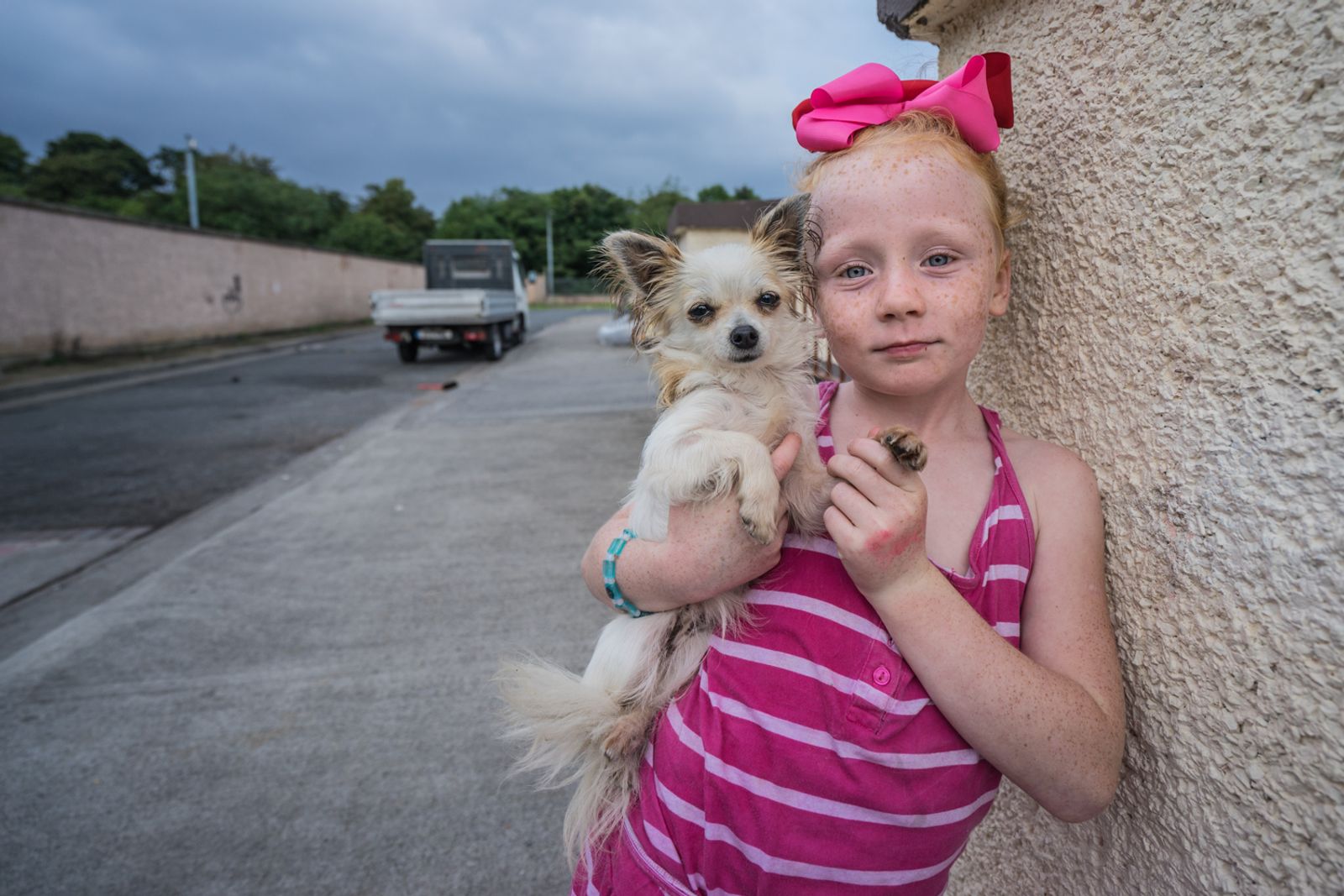 © Stephen Gerard Kelly - Maggie (8) with her pet dog.