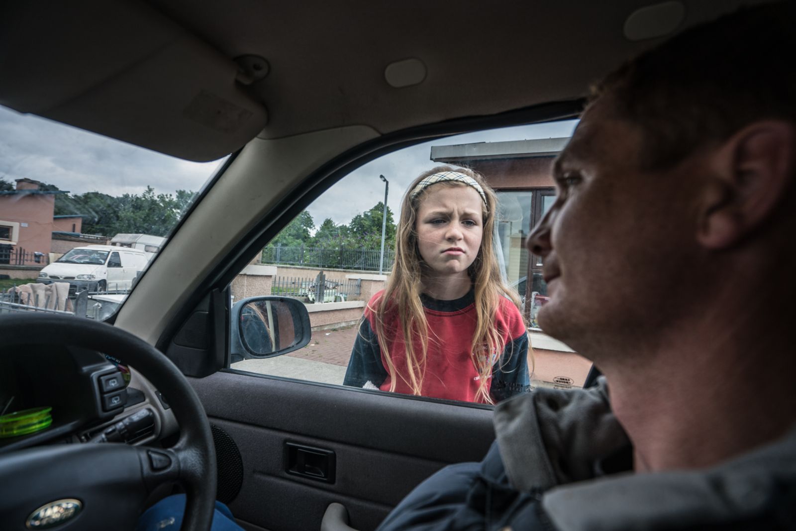 © Stephen Gerard Kelly - Megan (12) shows her frustration after asking her father Michael (32) for money to buy candy.