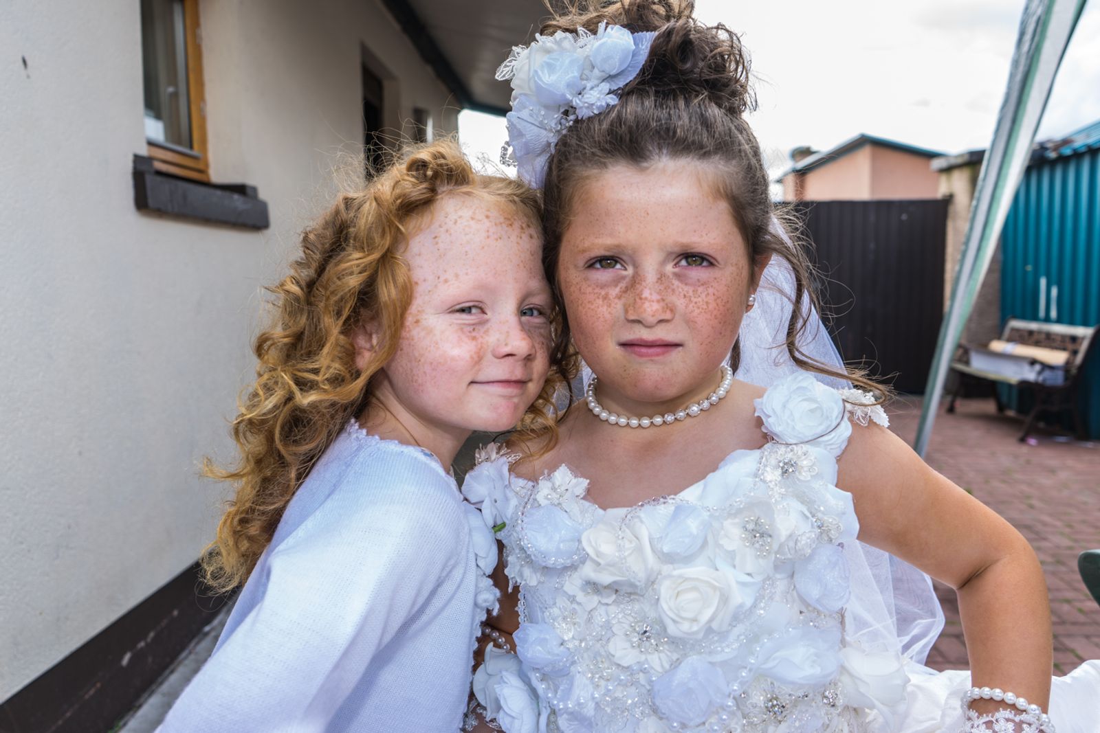 © Stephen Gerard Kelly - Mary (6) and Maggie (7), Irish Travellers, on the day of their First Holy Communion.