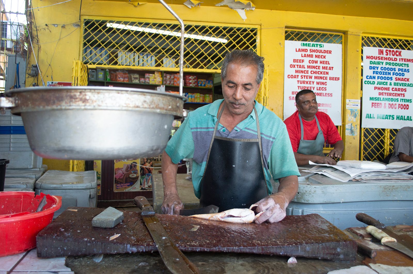 © Johanne Rahaman - A fish vendor at the San Juan Market. San Juan, Trinidad 2016
