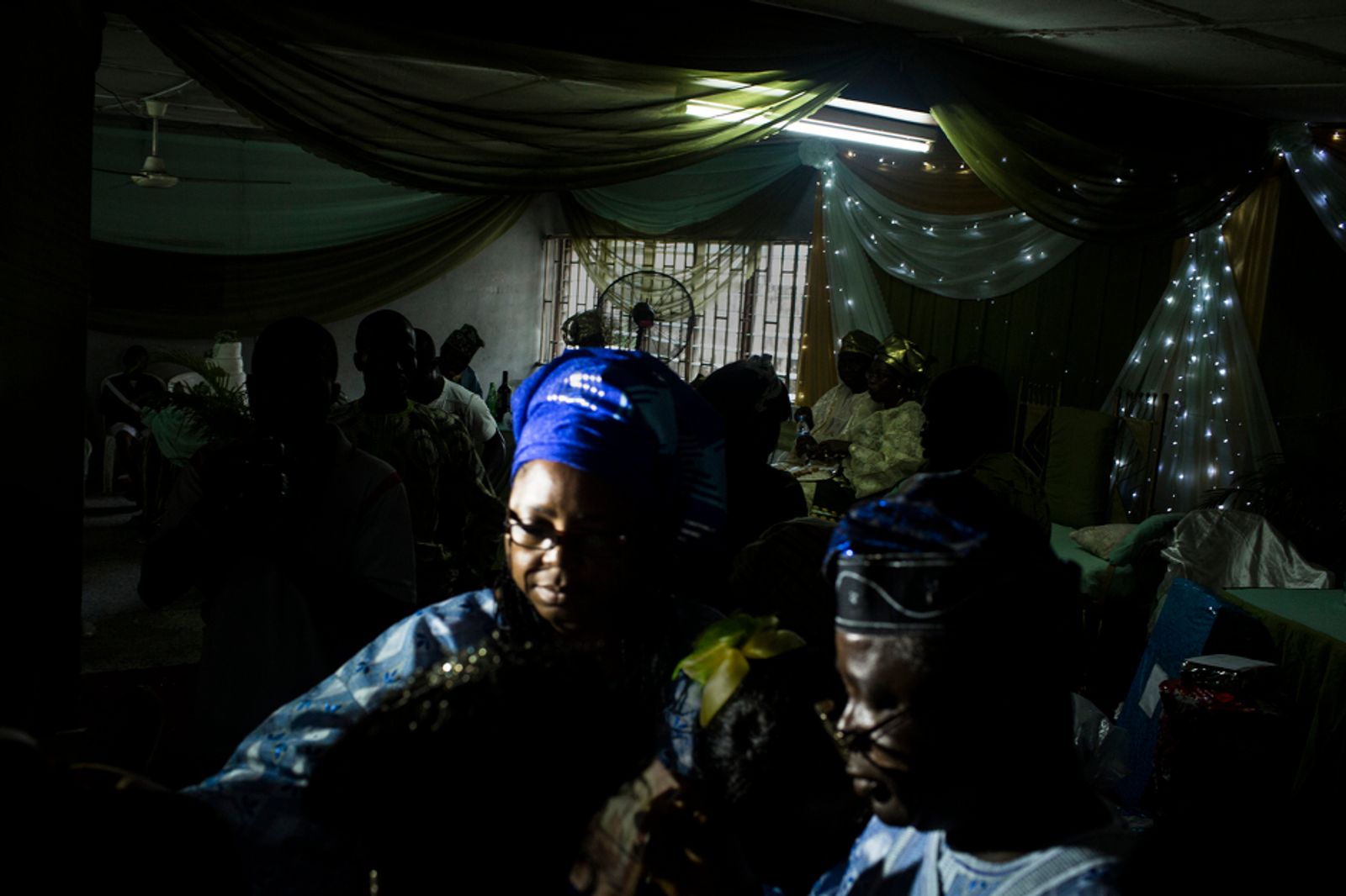 © Glenna Gordon - A couple walks through the dance floor at a wedding in Lagos in October.