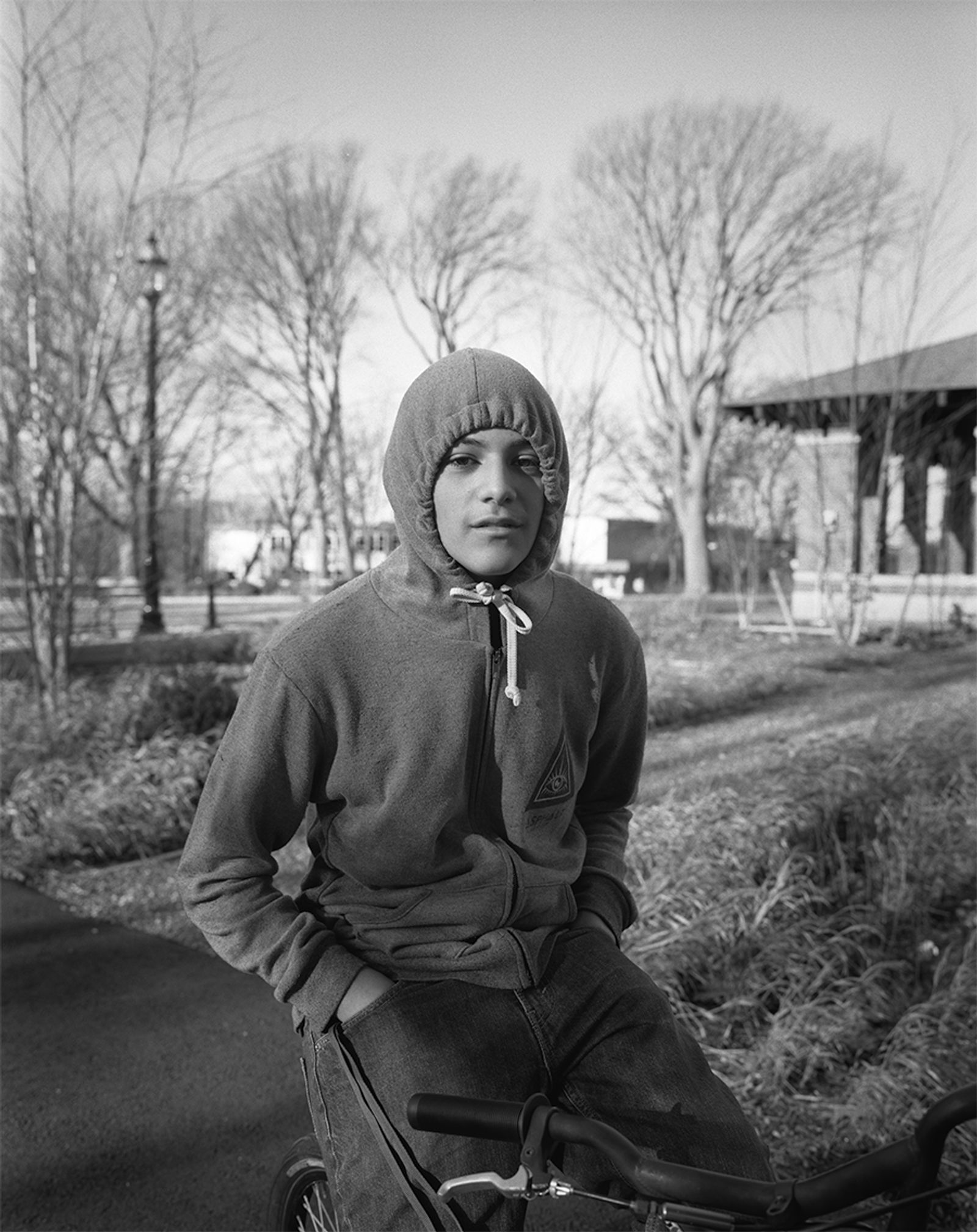 © Nicholas Pollack - Boy on bike, Branch Brook Park, Newark, New Jersey, 2014. Scan of 6x7 film negative.