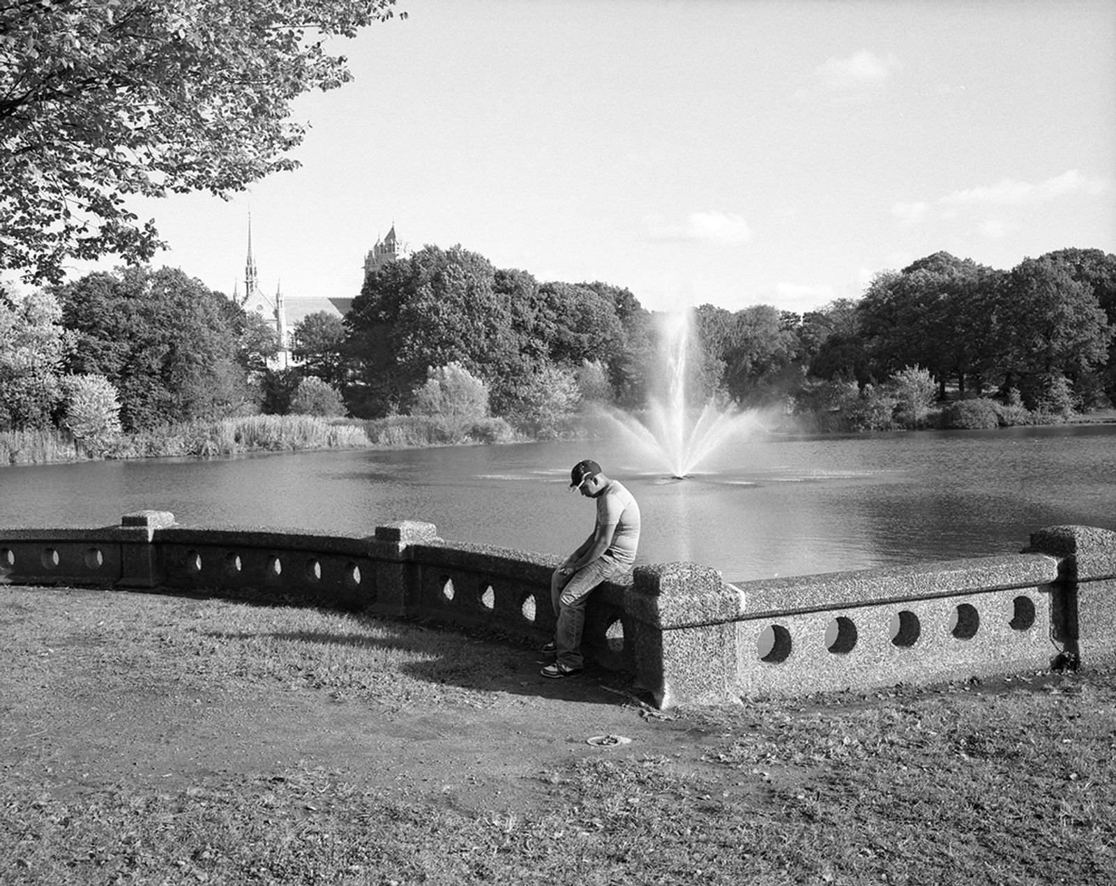 © Nicholas Pollack - Man and fountain, Branch Brook Park, Newark, New Jersey, 2014. Scan of 6x7 film negative.