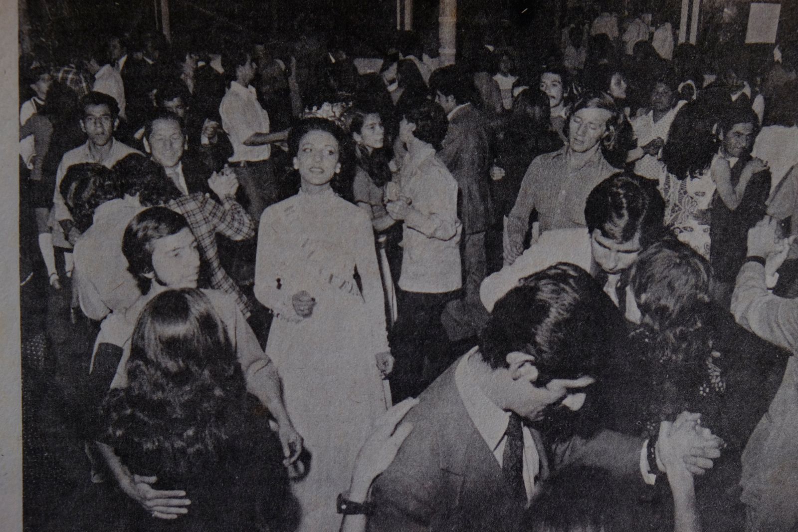 © Santiago Escobar-Jaramillo - Newspaper clipping of a photo shows the beauty pageant dancing alone in the Social Club of Manizales, Colombia.