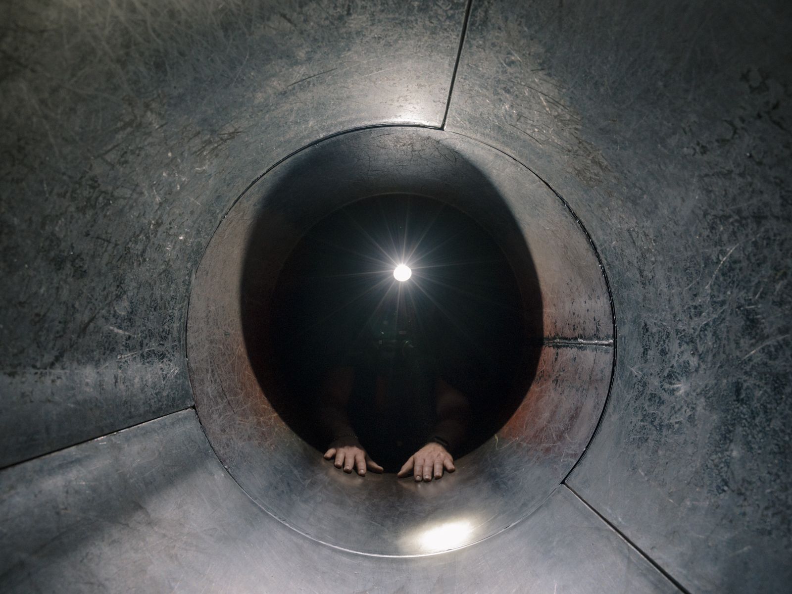 © Arne Piepke - During training, the men often have to crawl through narrow tubes.