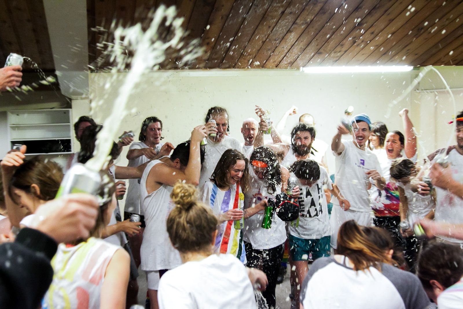 © J Forsyth - The Unicorns celebrate (the usual) lose by singing their song and having a 'beer shower' in the change rooms after the game