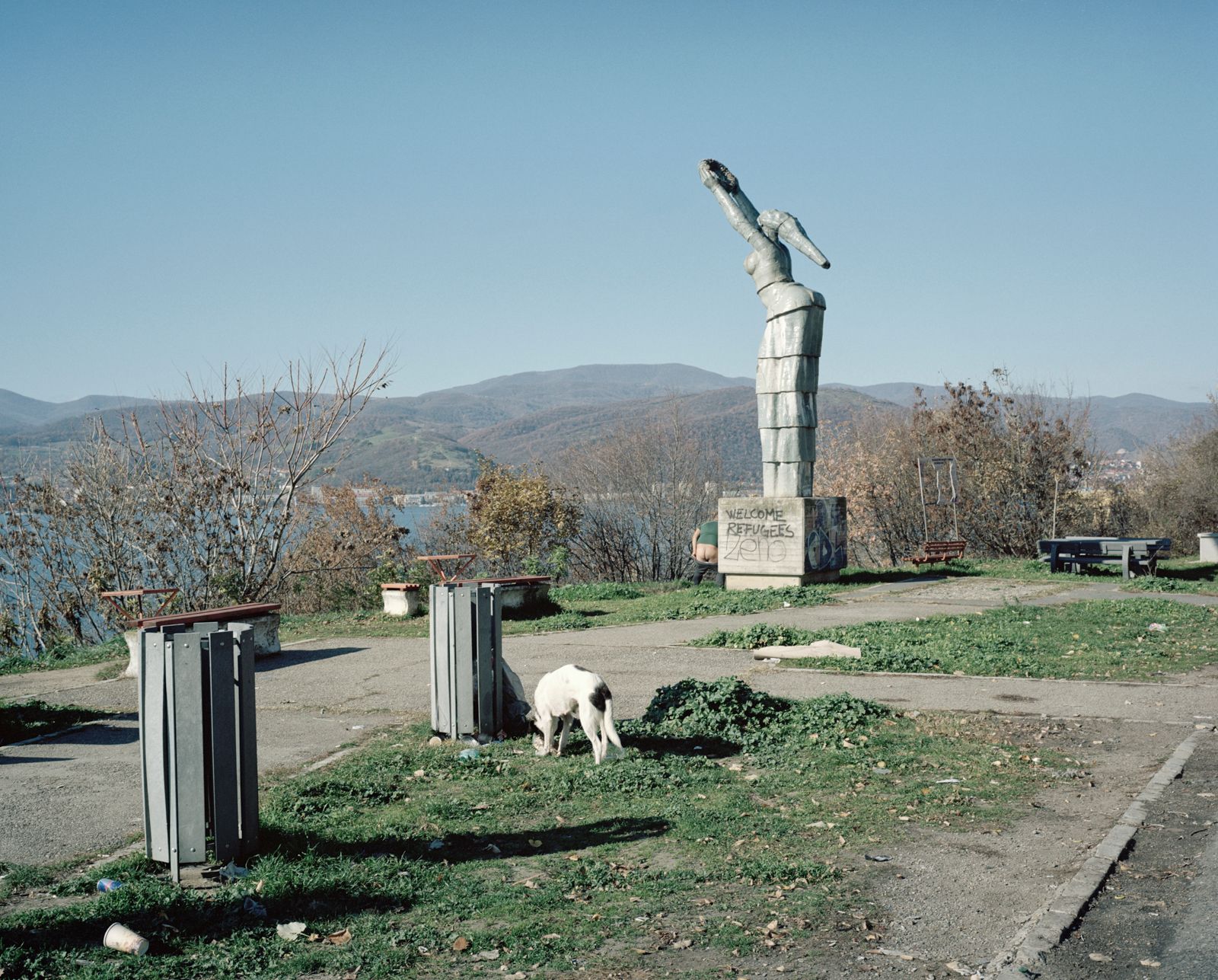 © Tommaso Rada - Romania, Orsova. A communist style monument with a wrote welcoming refugees