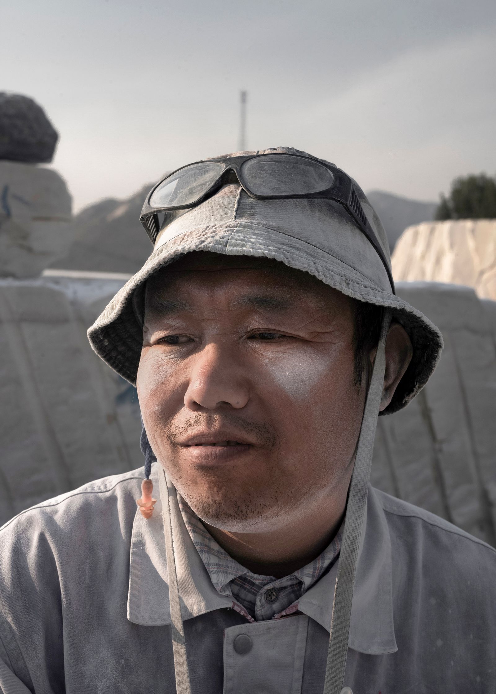 © Pang Hai - Worker: Covered with white powder, he has a simple blank thought.