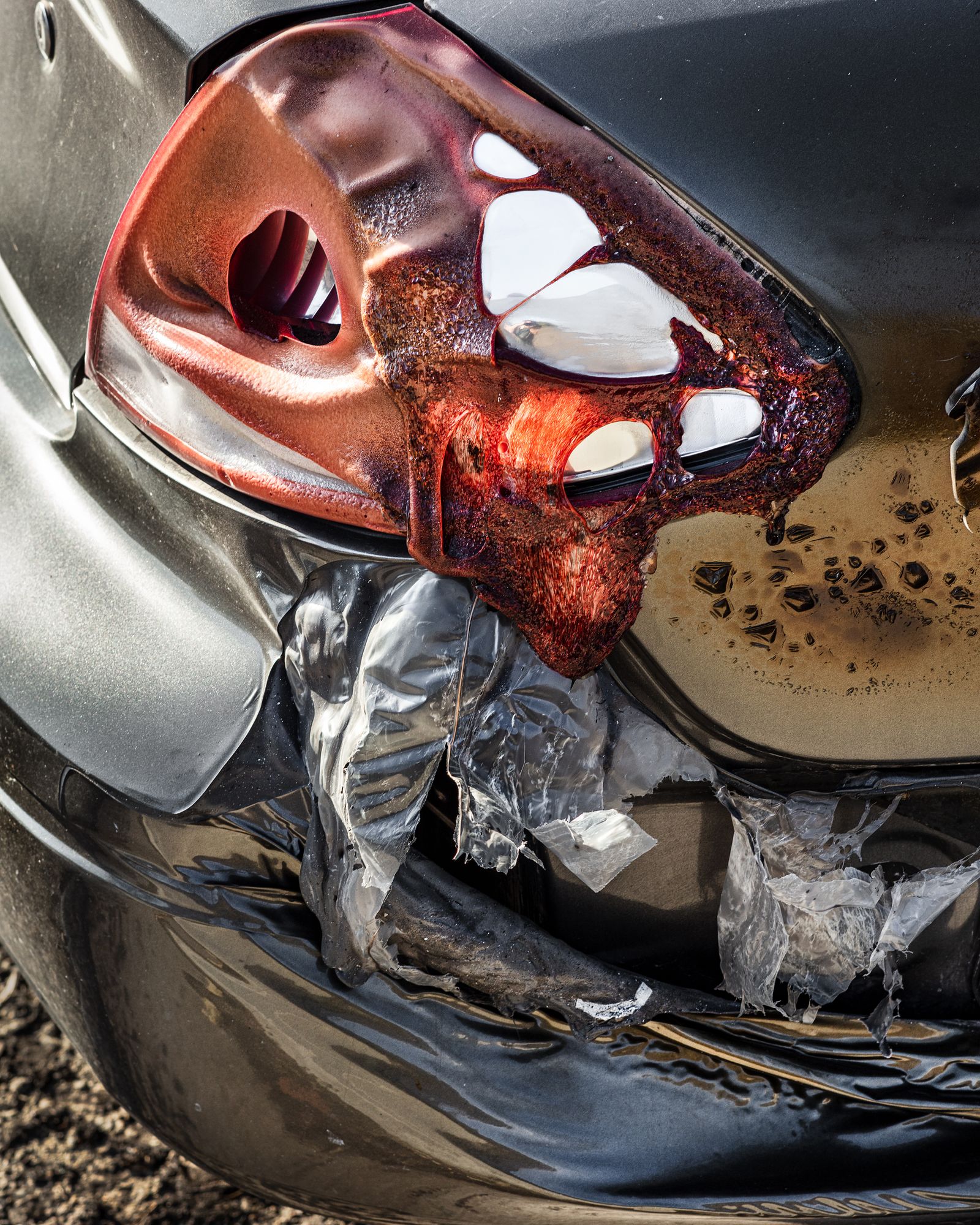© Anastasia Samoylova - Automobile taillight melted in Tick Fire, CA