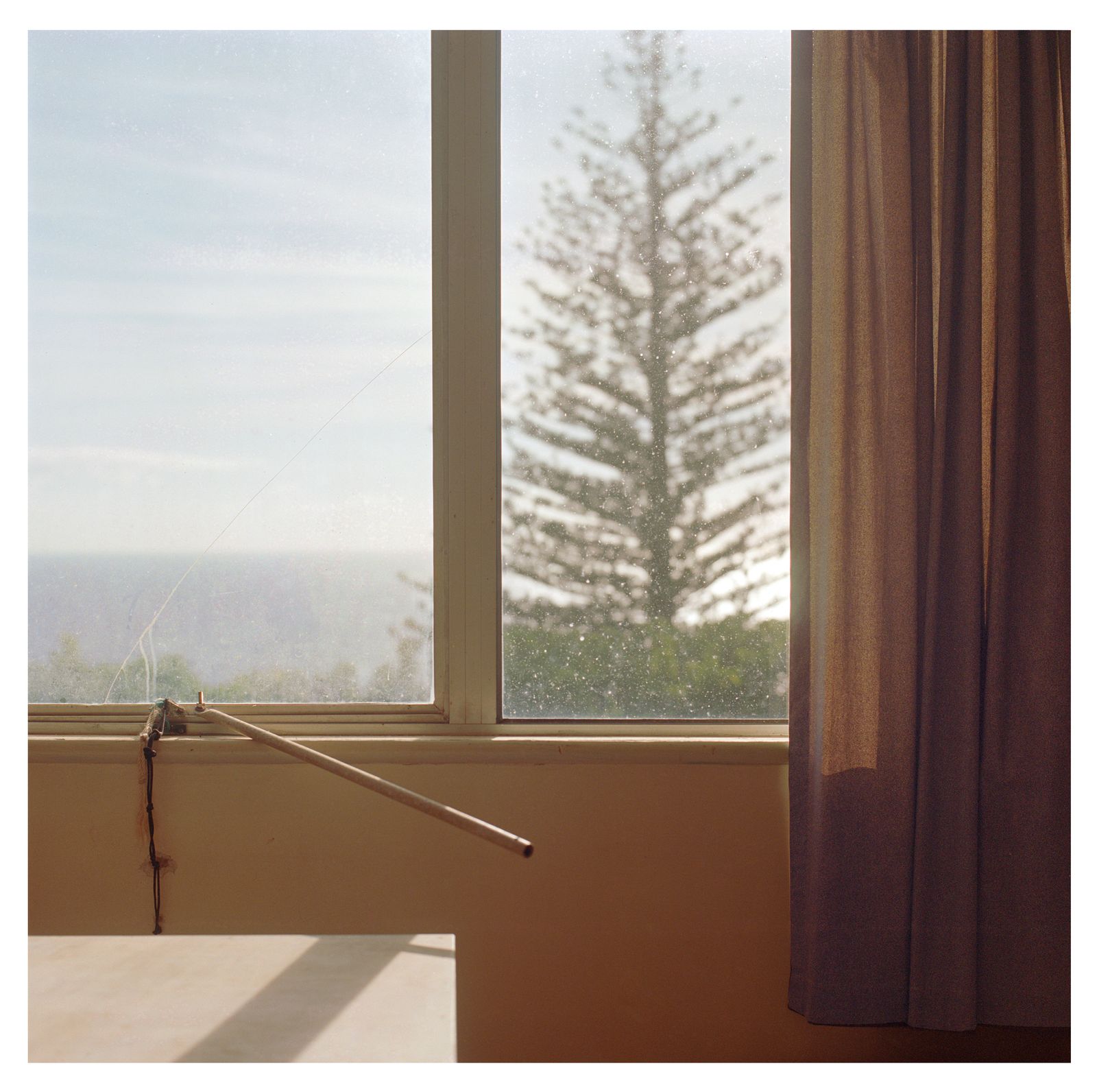 © Rhiannon Adam - The view of the Pacific from an empty room at Big Fence, the childhood home of Shawn and Randy Christian.