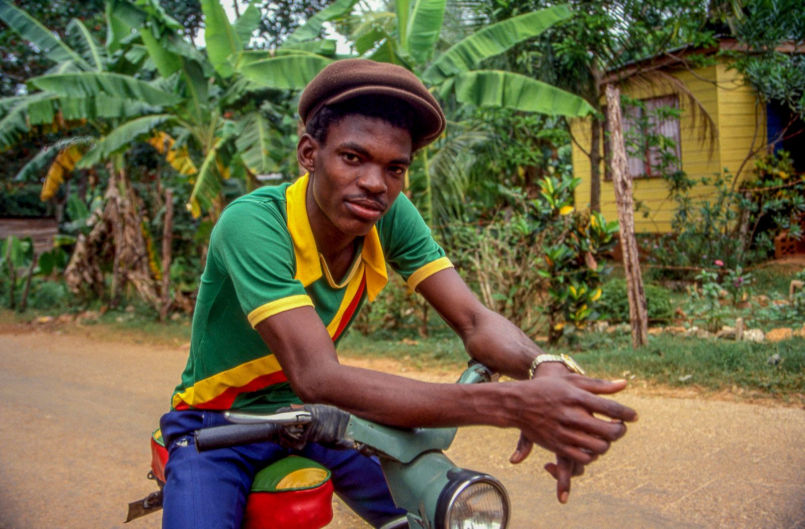 © Steven Edson - Portrait of a young man with scooter. Jamaica