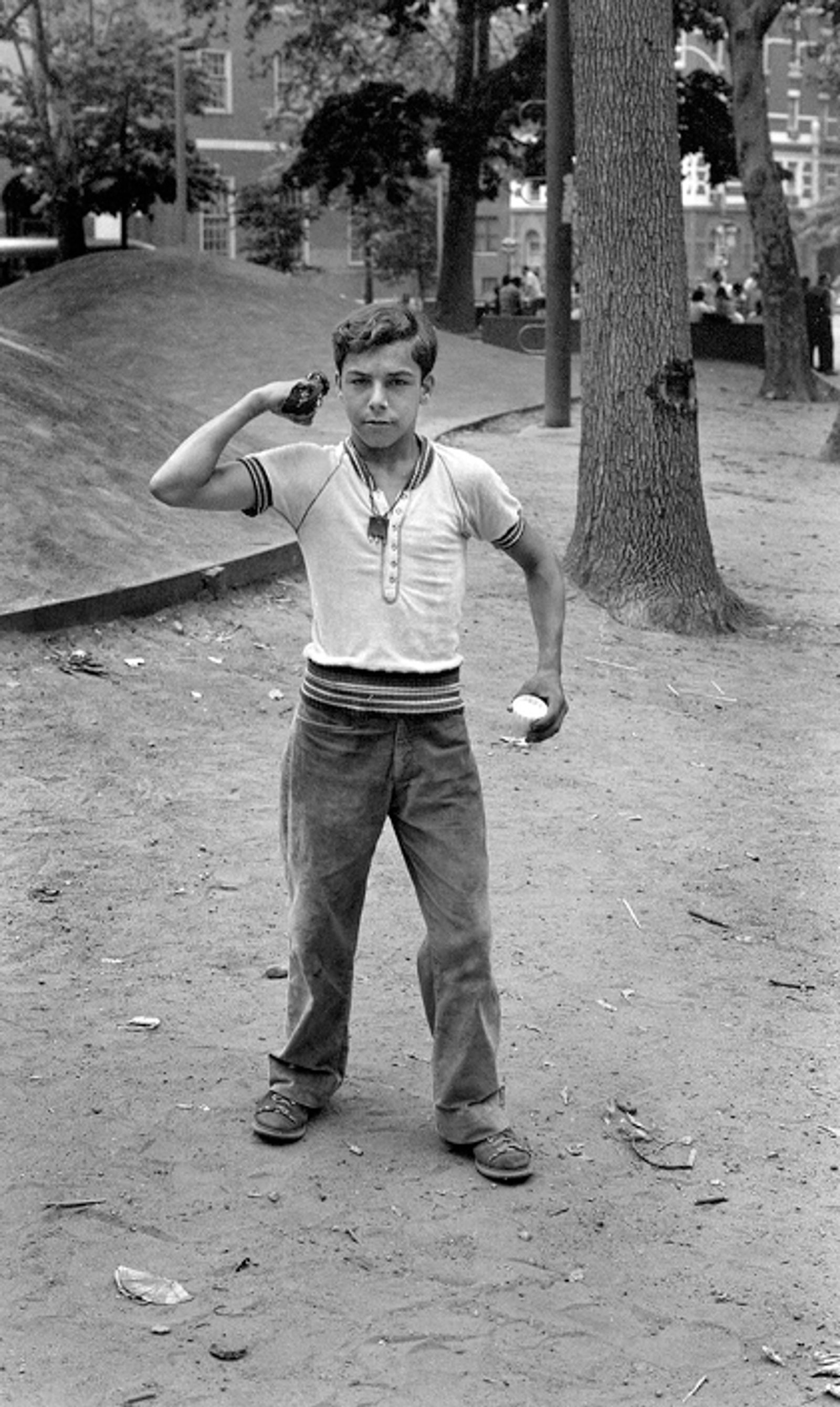 © Steven Edson - Boy as a muscle man in park. NYC, NY 1973