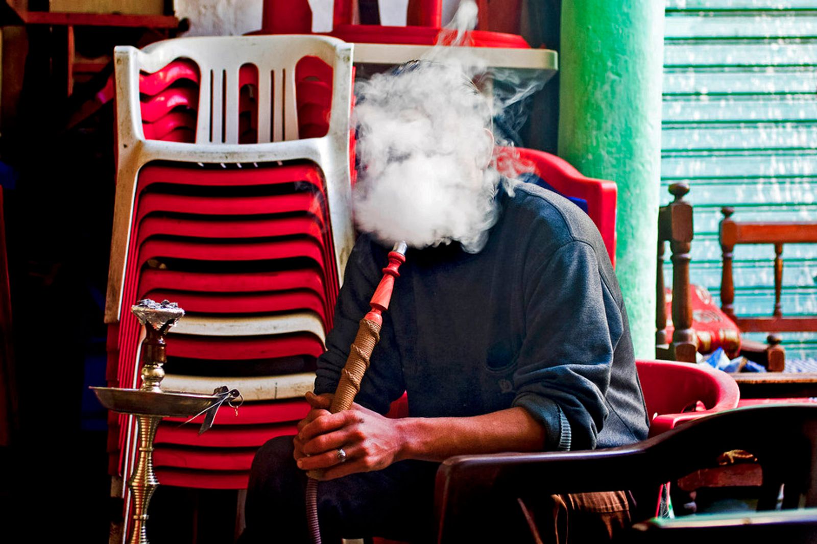 © Steven Edson - Man smoking shisha at the cafe. Tripoli Libya.