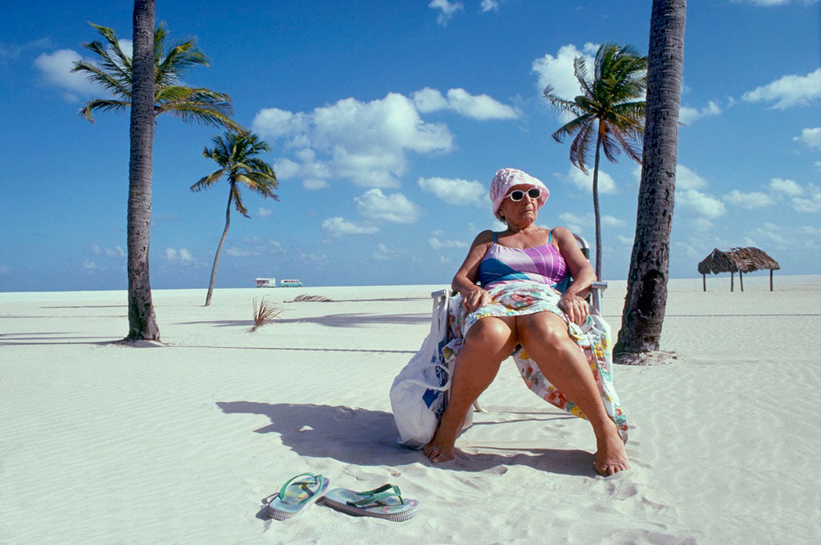 © Steven Edson - Old lady sitting on South Beach, Miami, FL