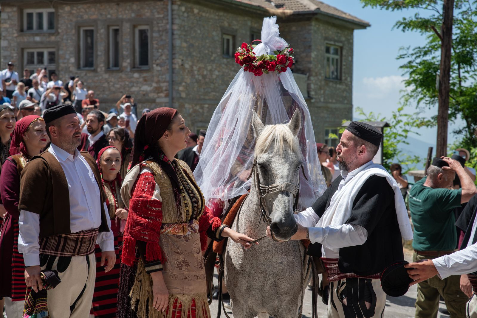 © Biljana Jurukovski - The bride arrives on a horse in the middle of the village before she is taken to the church for the wedding ceremony