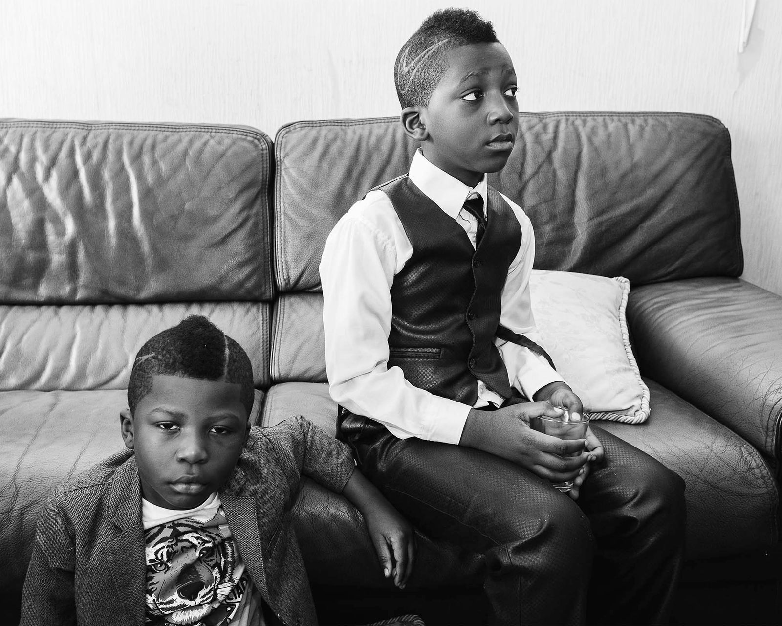 © Rebecca  Fertinel - Boys are waiting between ceremonies in their house