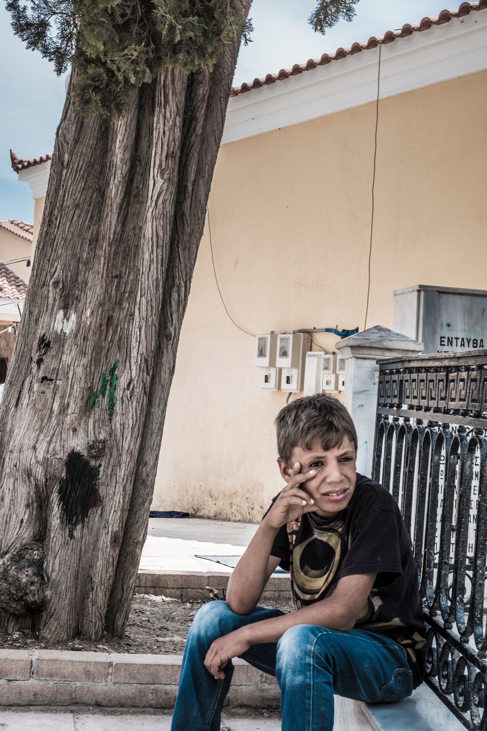 © John Perivolaris - Refugee Boy, Island of Chios, Greece, 2016.