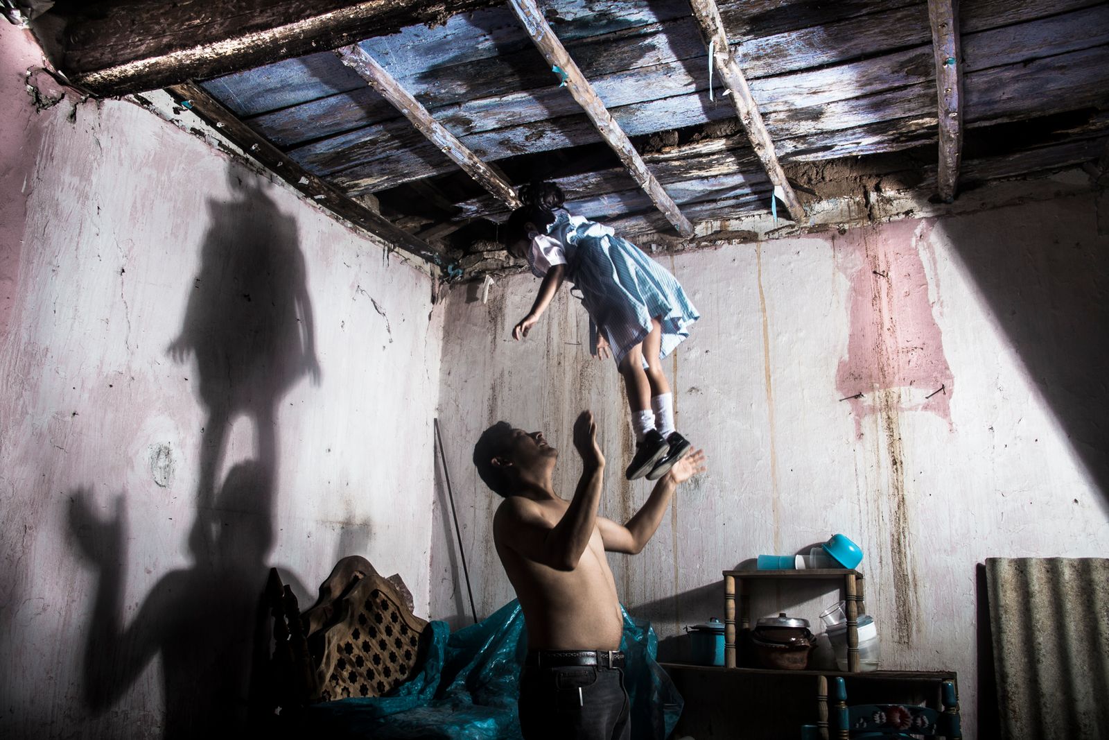 © Yael Martínez - The house that bleeds(self portrait with my daughter and apresence of a hanging man) Guerrero Mexico