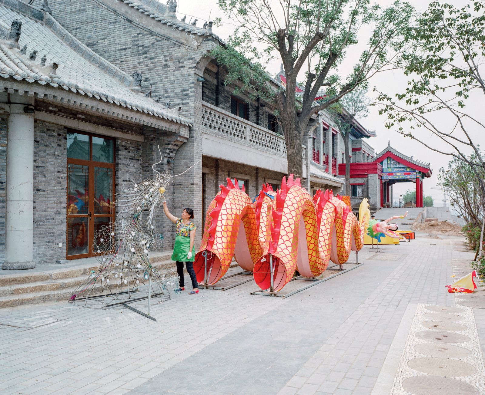 © Pan Wang - women decorating "dragon lantern"Tongguan, Shaanxi Province, China.