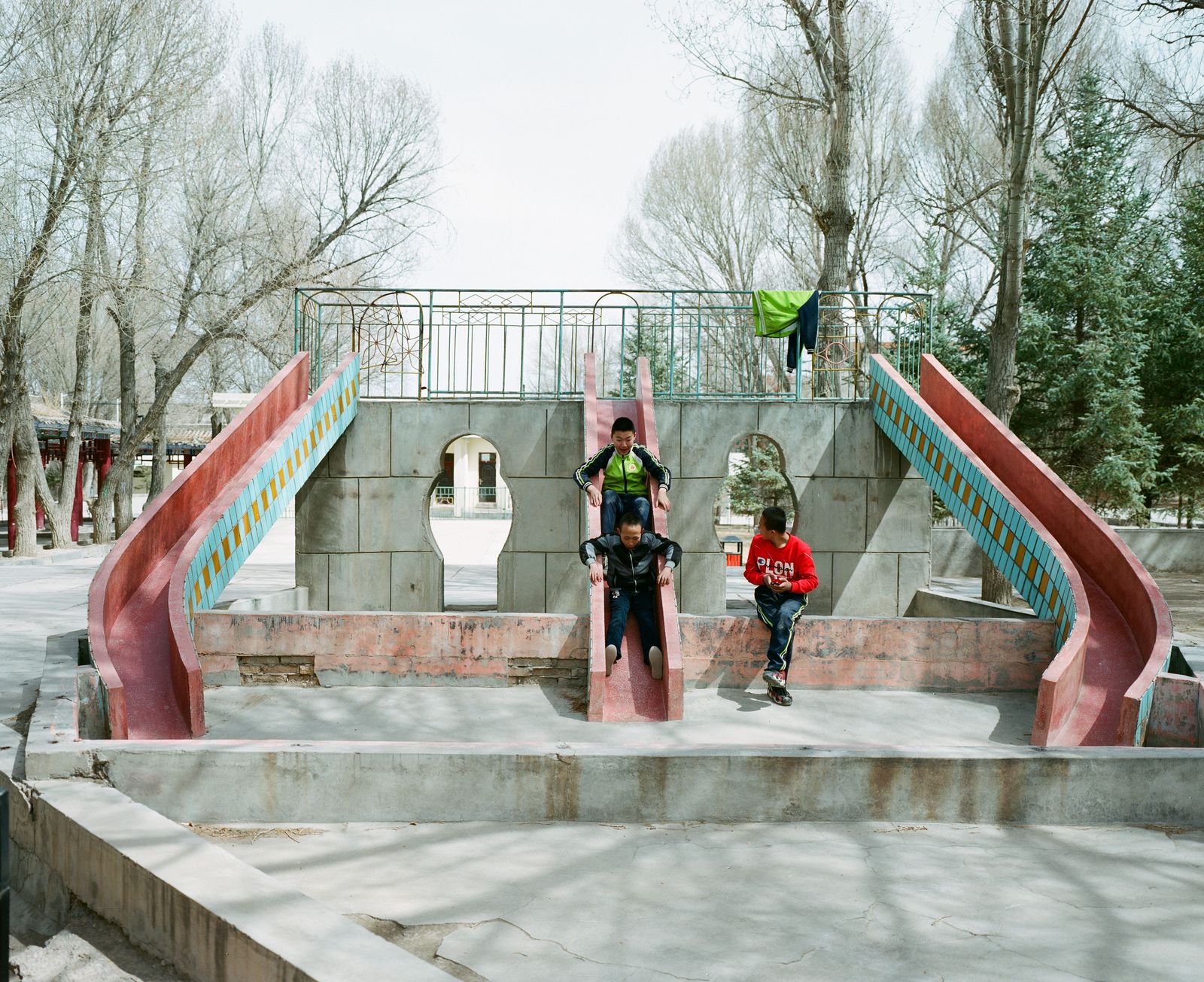 © Pan Wang - April 15, 2018，Yumen City, Gansu Province, China. Children playing in oil Parks