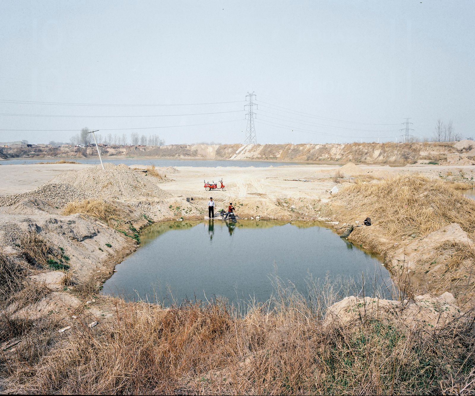 © Pan Wang - 17. Retired worker fishing in the river and his child