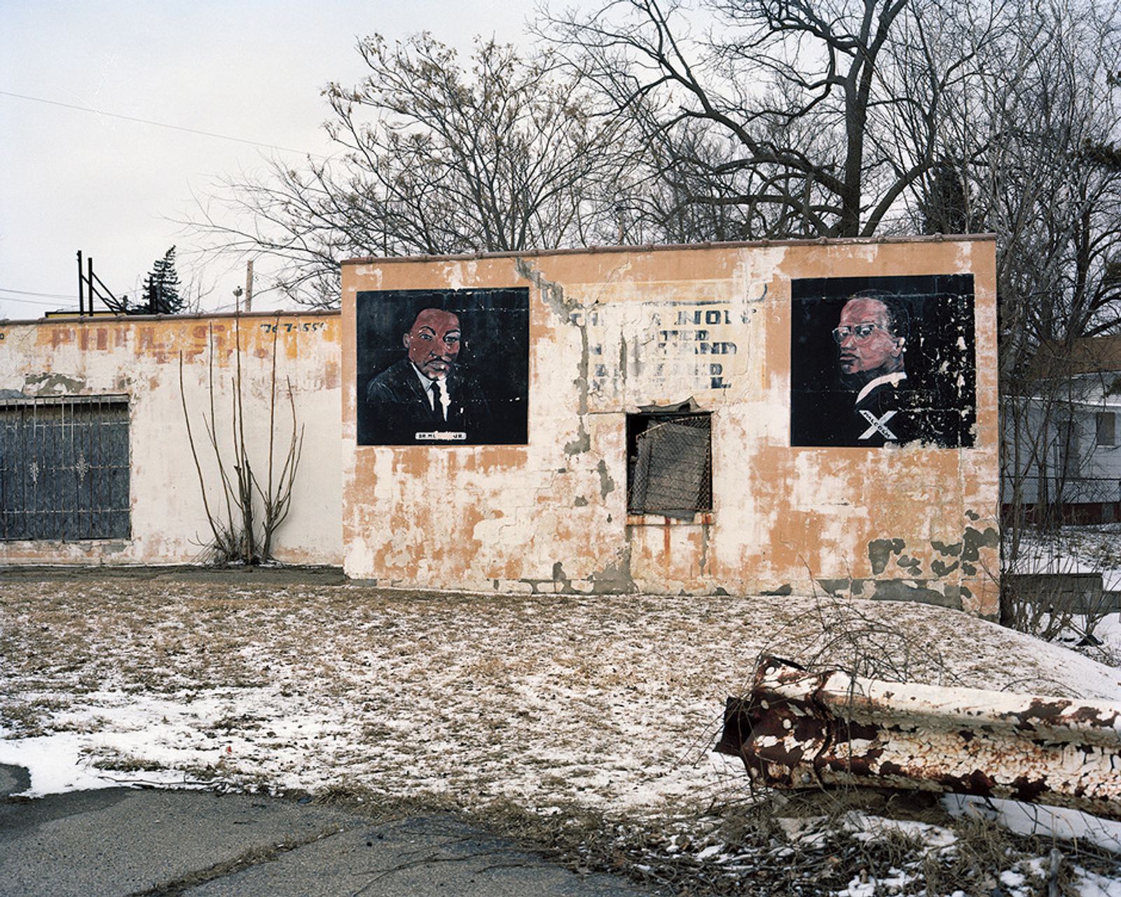 © Juan Madrid - A mural depicting Martin Luther King, Jr. and Malcolm X on the side of a dilapidated building on the North Side.