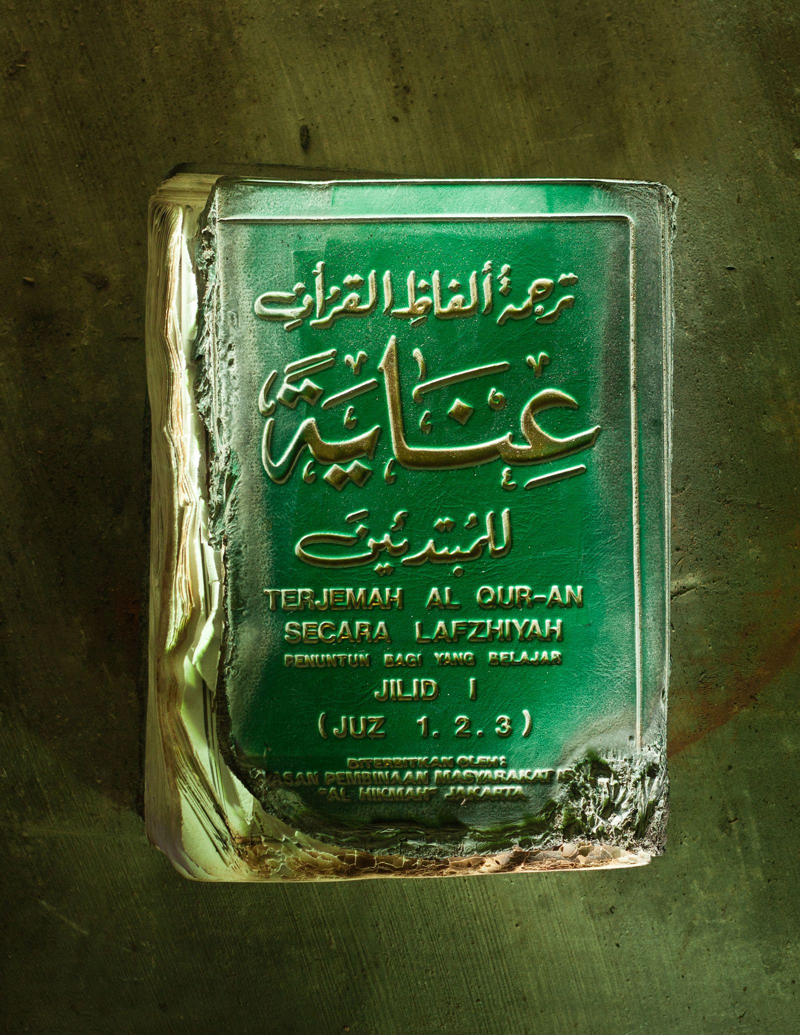 © Hahn Hartung - A Quran recovered from the ashes of the 2010 eruption of Mount Merapi.