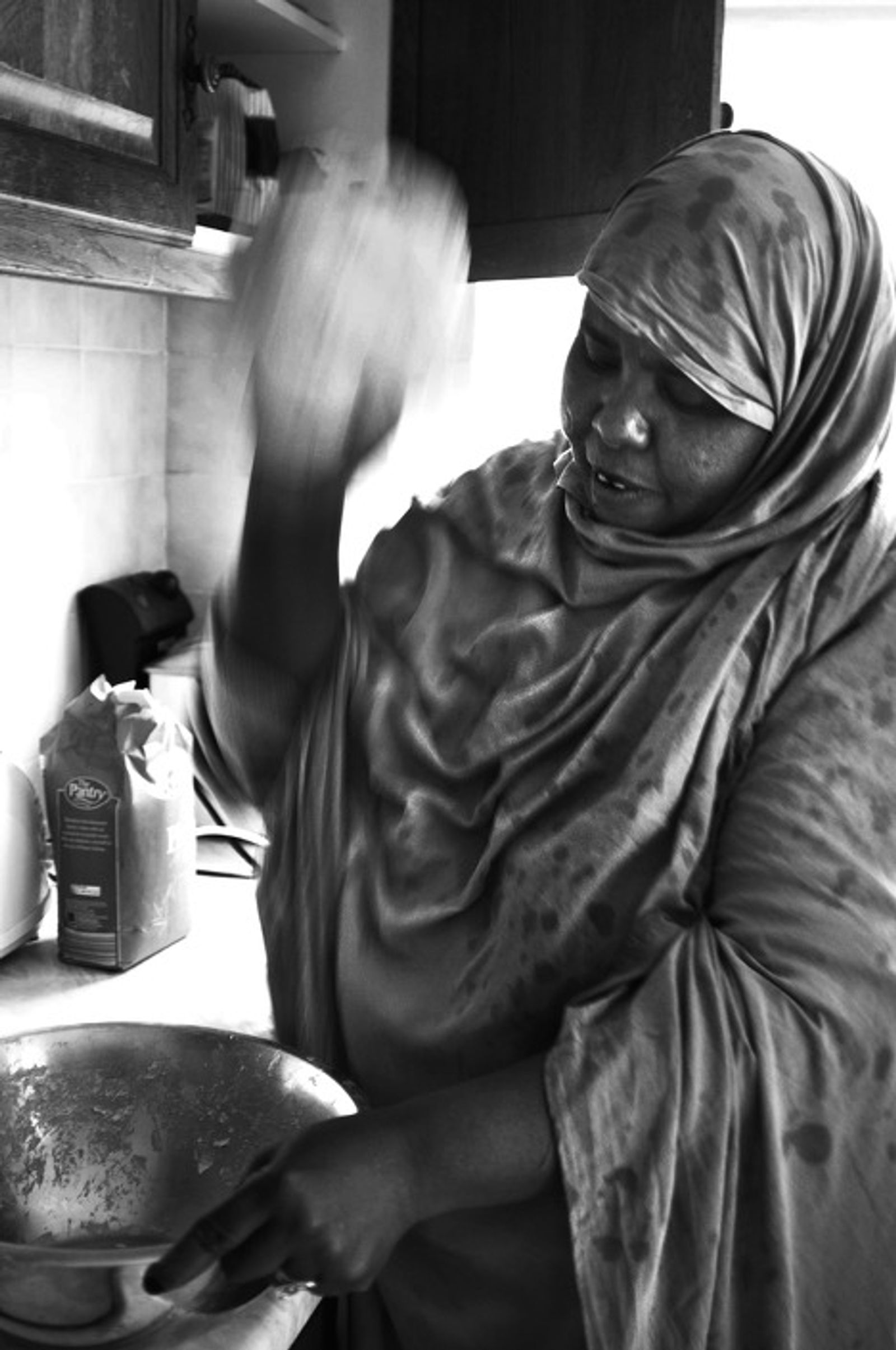 © Stephen Boyle - A Somali woman making traditional Somali bread. Lucan, June 2011.