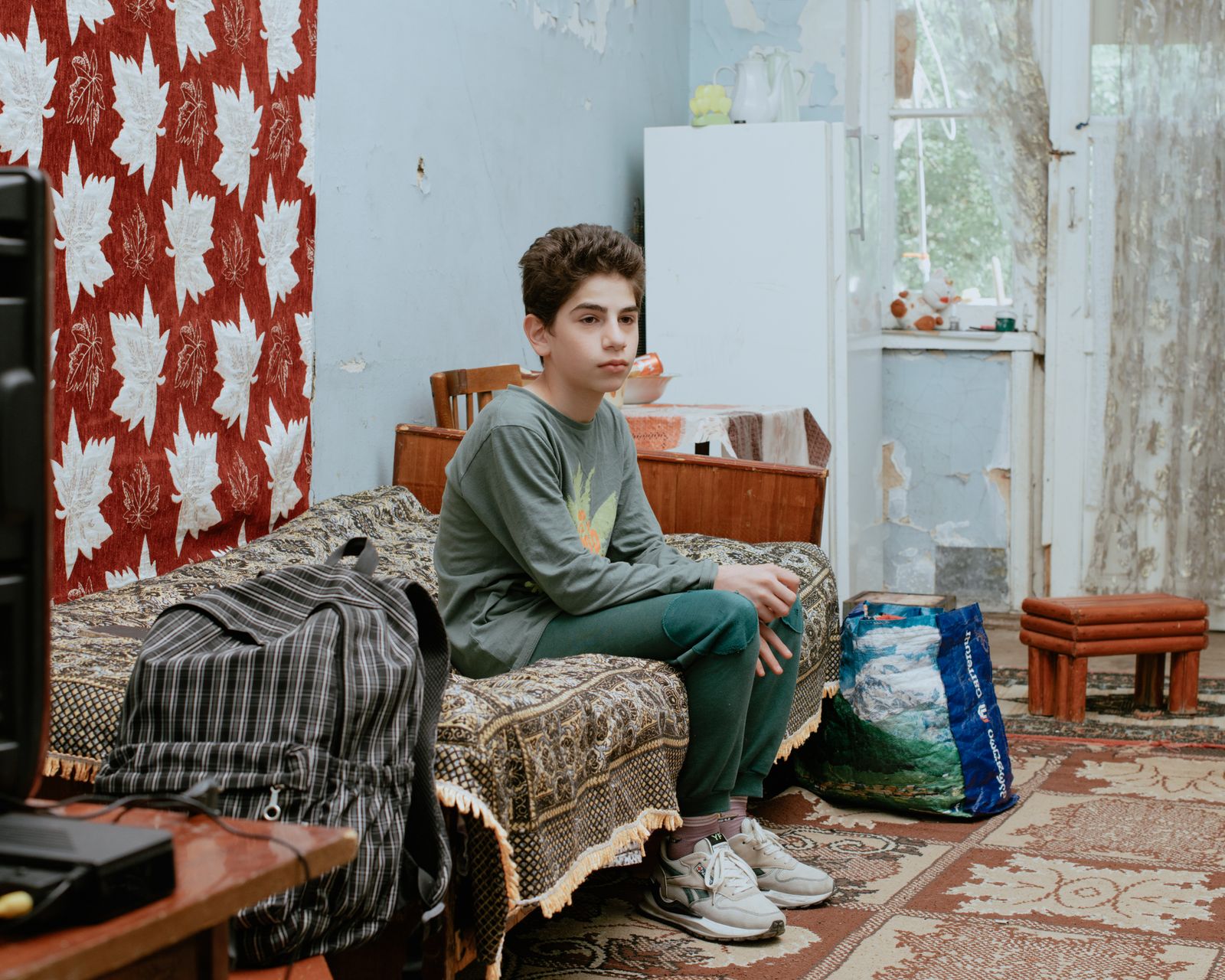© Jana Islinger - Luca 13 years old lives with his sister and his grandmother in an abandoned hotel in Tskaltubo, Georgia
