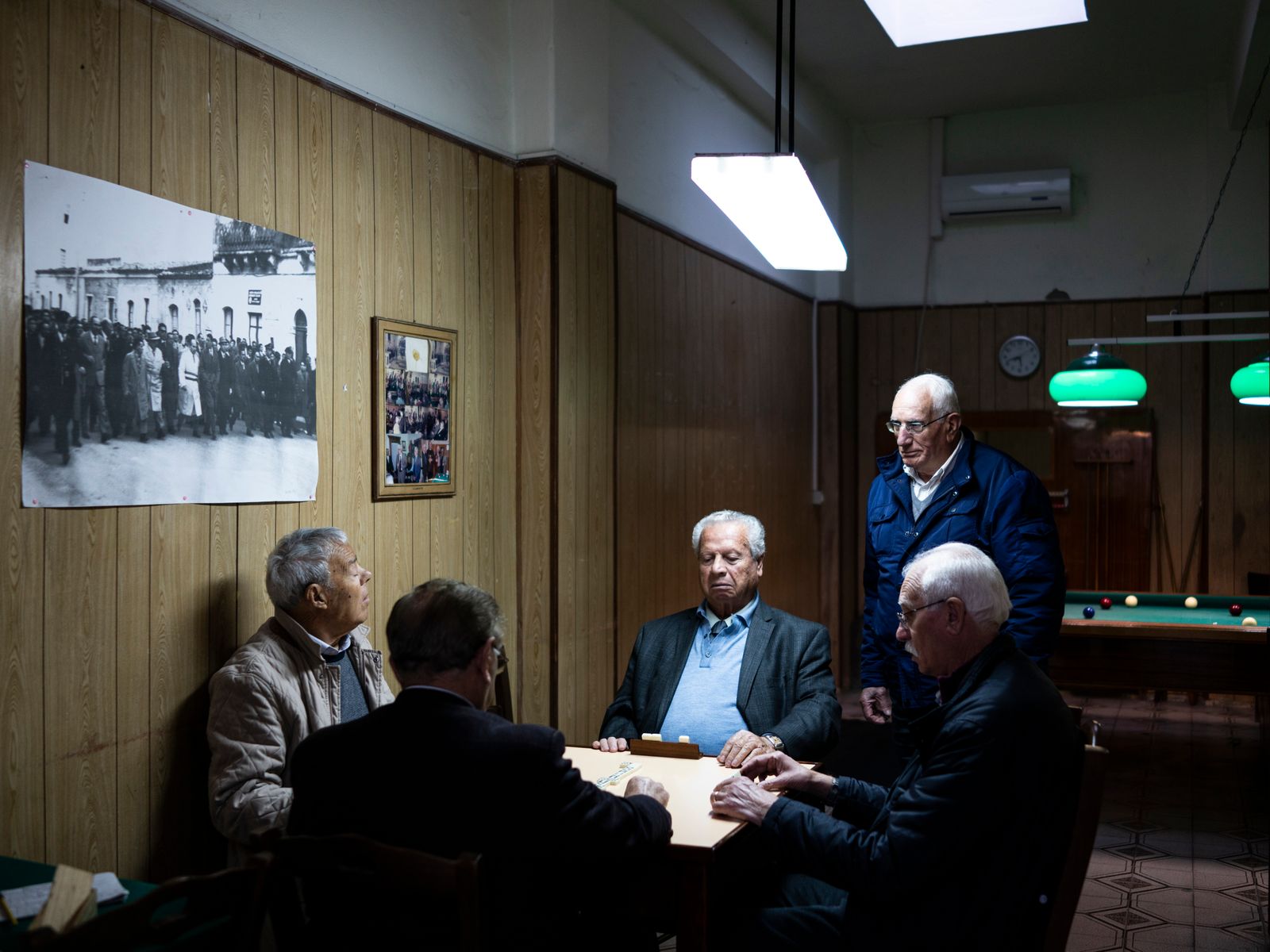 © Sebastian Wells - Older men meet to play Domino at the Philantropic Association. All of them are former refinery workers. Augusta, April 2019.