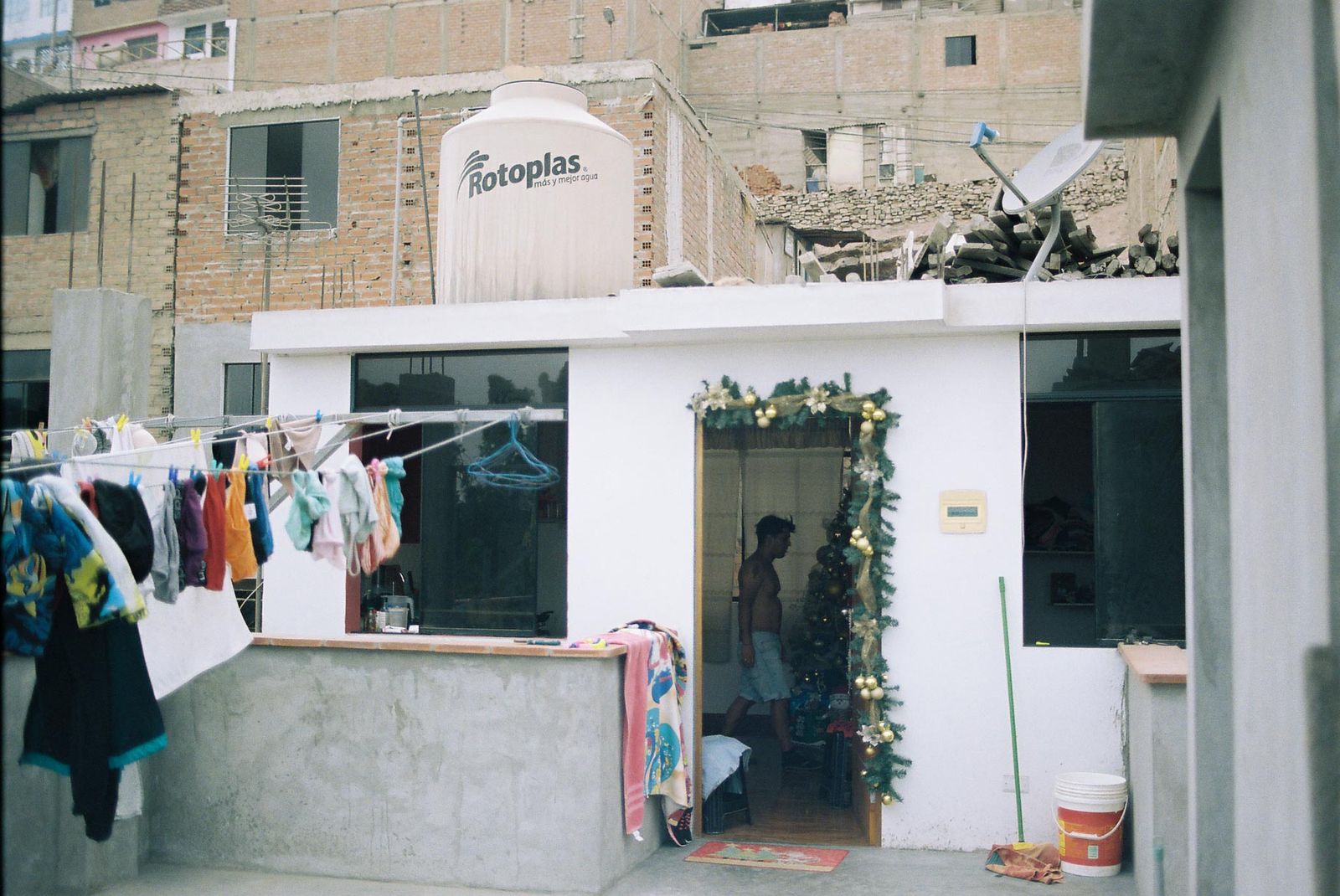 © Daniela Rivera Antara - Outside the house in San Juan de Miraflores, where Maria Jose and Isabel live.