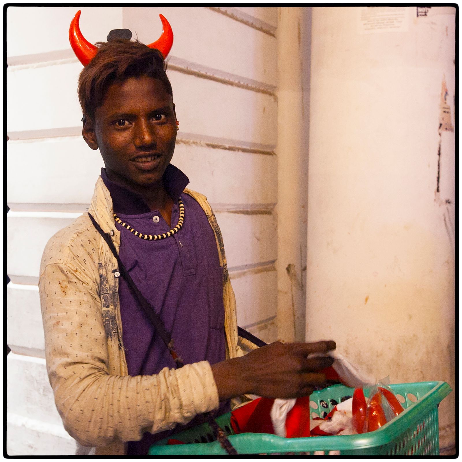 © Vijay S. Jodha - Teenager selling caps and horns.