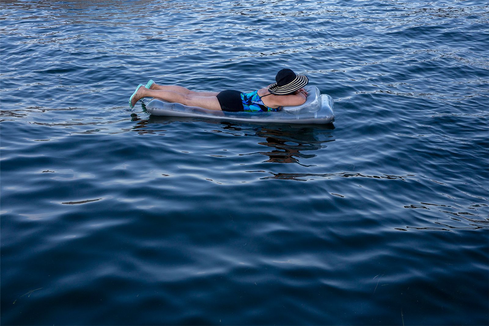© Rachel Jessen - A woman floats on West Okoboji Lake. (Dickinson County)
