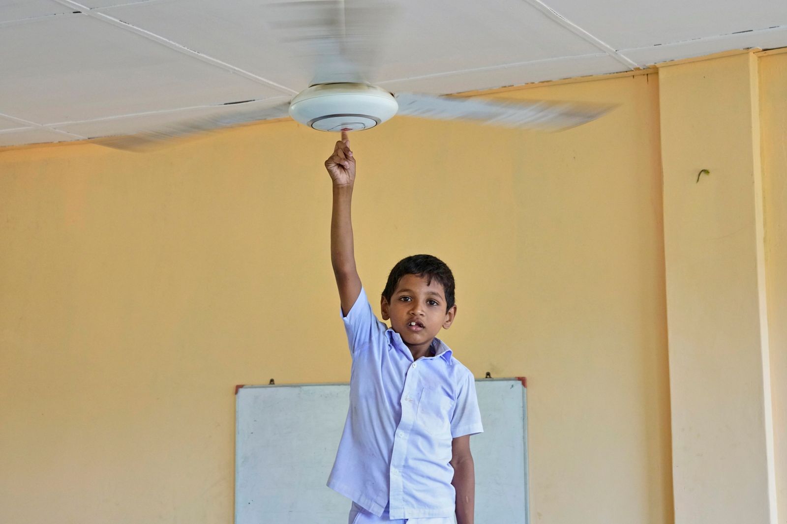 © Kai Yokoyama - Inshahu, suffering from mental retardation, poses with the fans. He often fights with other students.