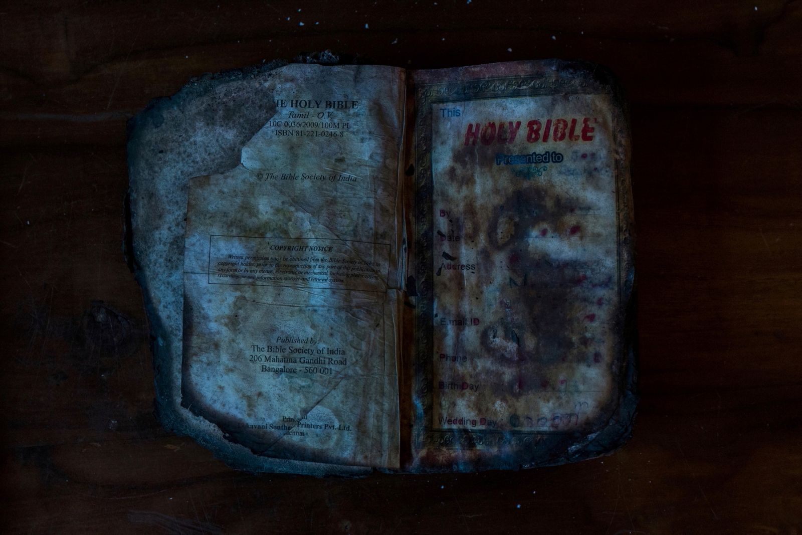 © Kai Yokoyama - Bible/A burnt Bible found in the church whose owner is still unknown.