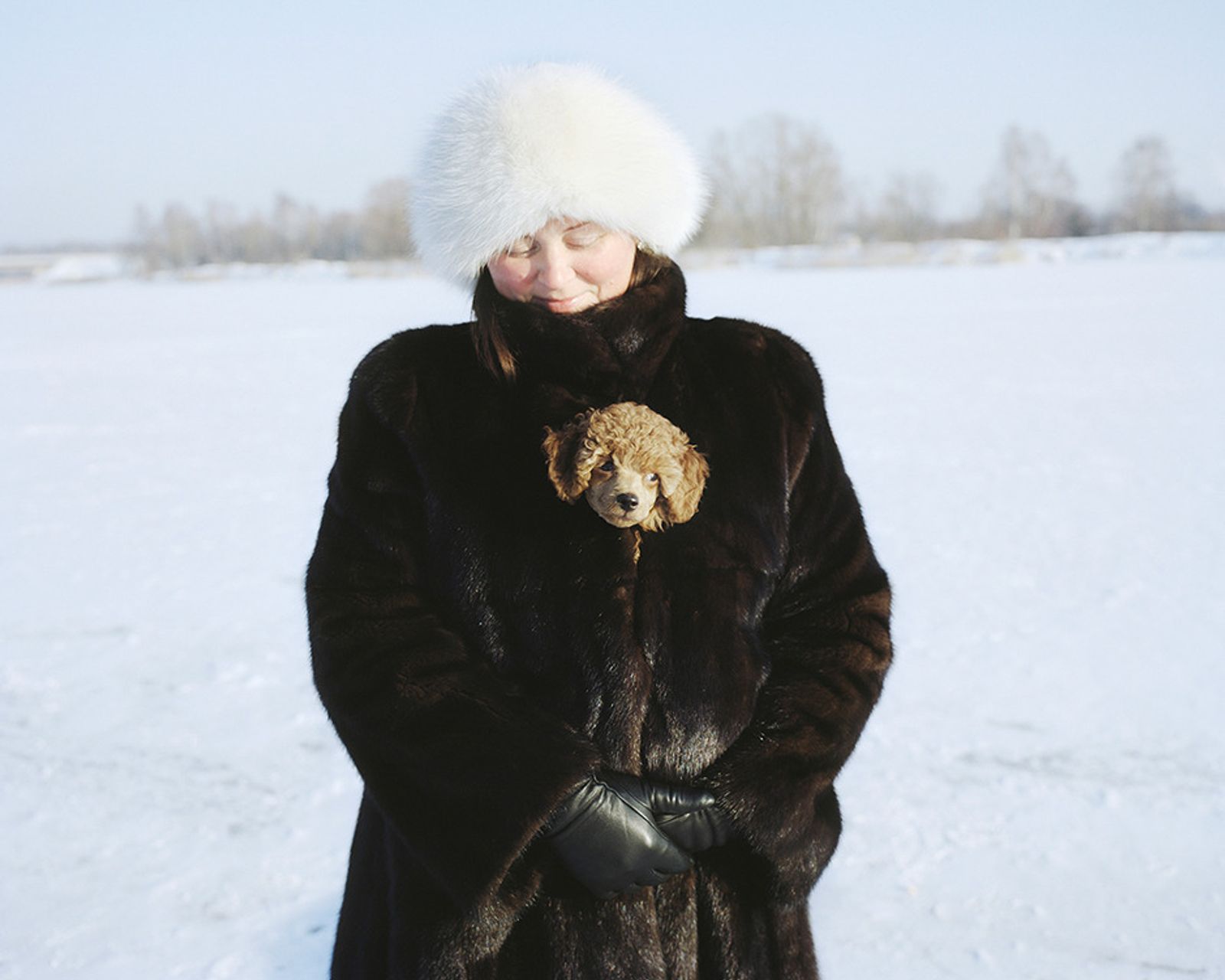 © Andrejs Strokins - Olga with her dog on frozen Buļļupe river, 2012