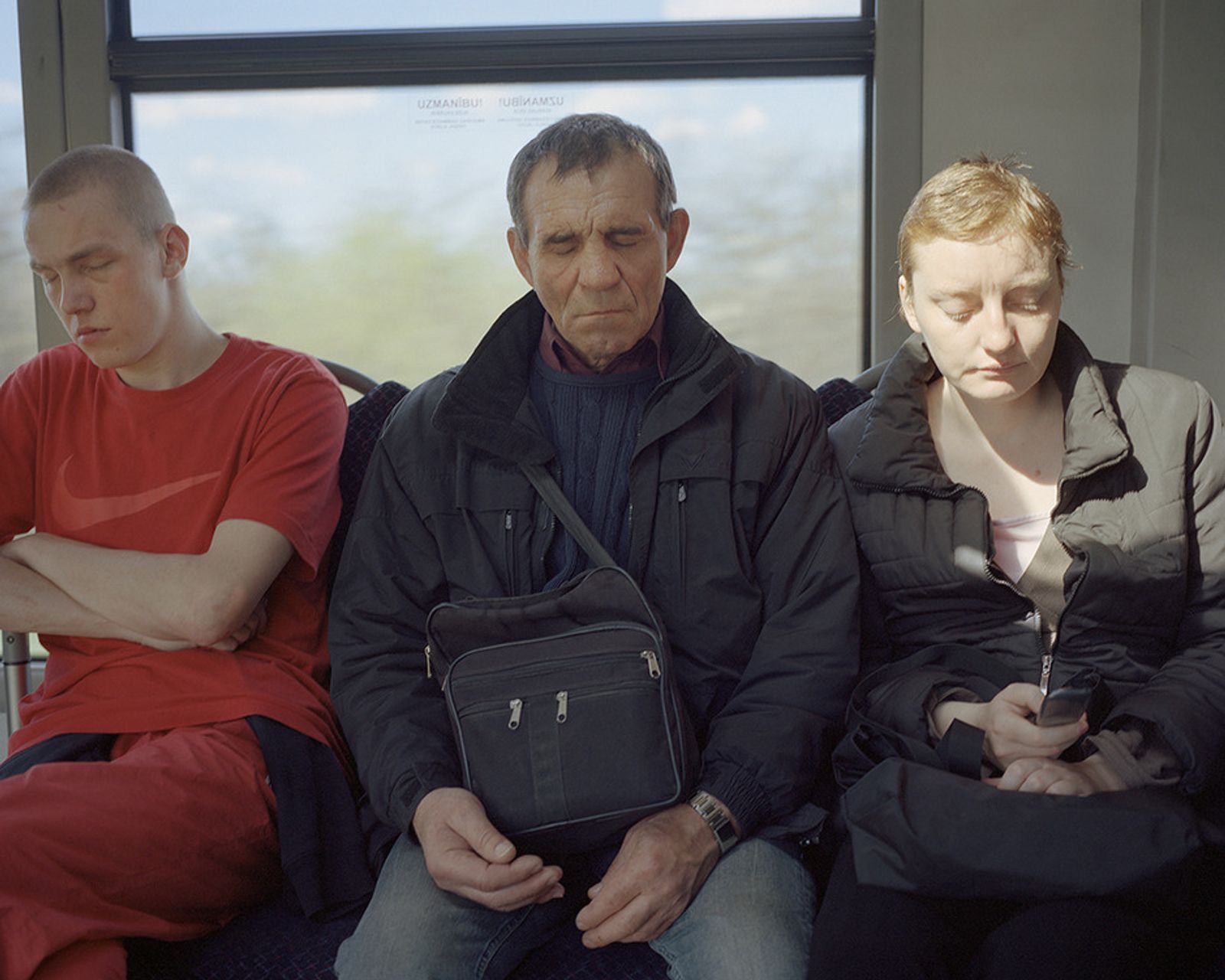 © Andrejs Strokins - Passengers in Pļavnieki - Bolderaja bus, 2012