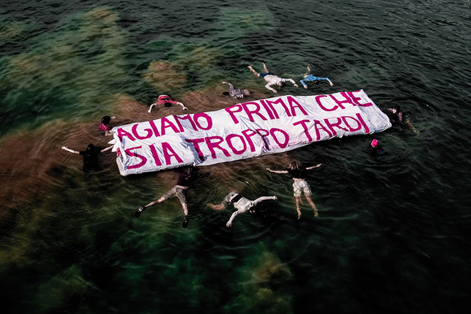 © Maria Giulia Trombini - "Let's take action before it's too late", action in the Eur lake in front of Enel Palace, Rome.