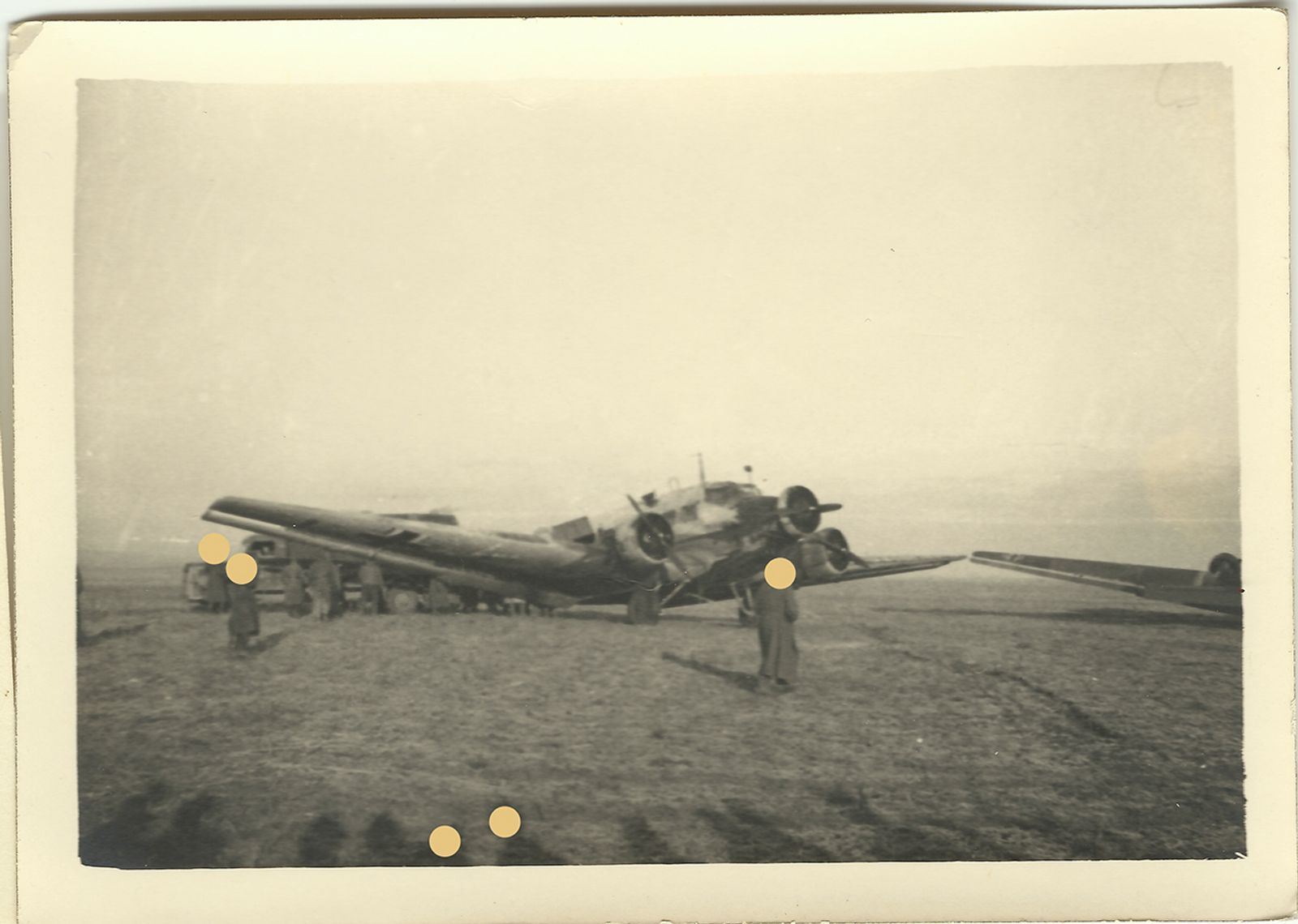 © Sarah Pabst - A photo of my grandfather's archive, a german plane in Russia. The dots resemble the holes in my inherited memories.