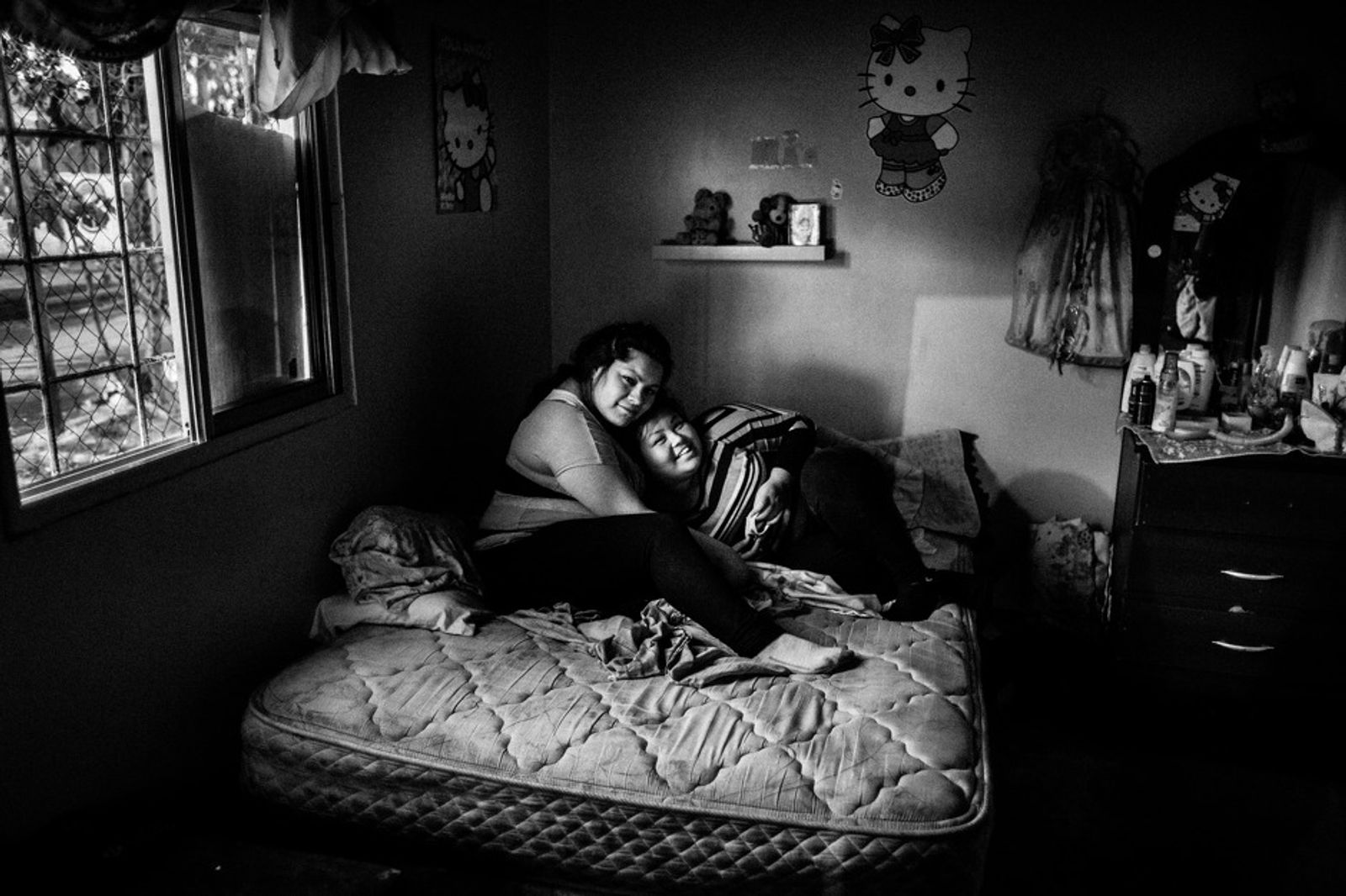 © Sarah Pabst - Daiana (left) and Stefi at Stefi's house in Monte Chingolo, Lanús, Province of Buenos Aires.