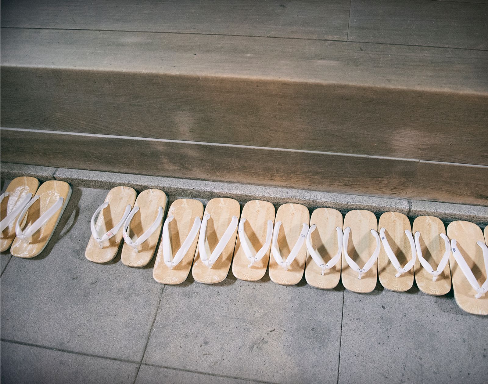 © Lieh Sugai - Kannushi (Shinto priest) zouri sandals lined up inside the shrine.