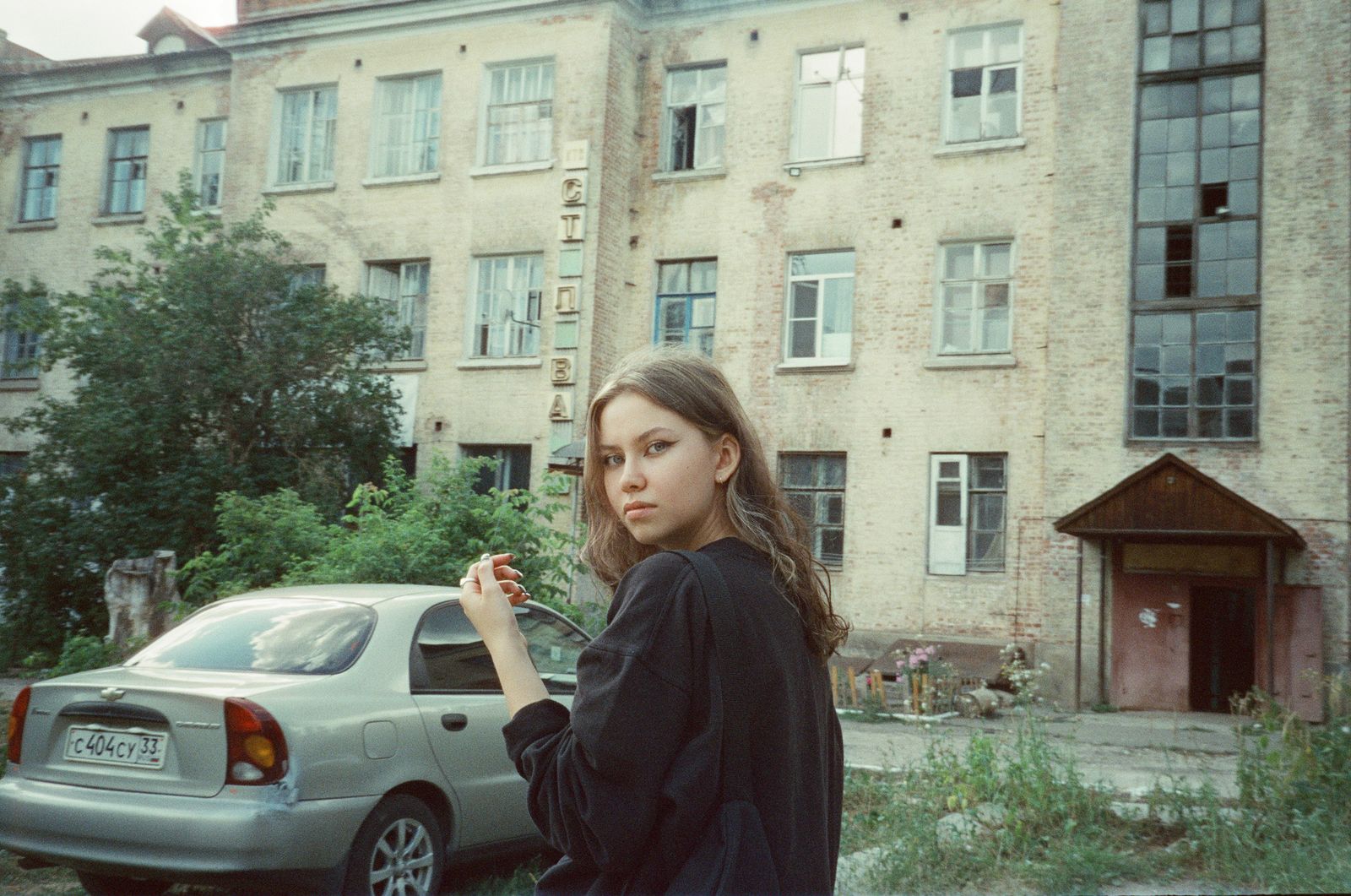 © Toma Gerzha - Anya and the house where her parents' apartment is located.